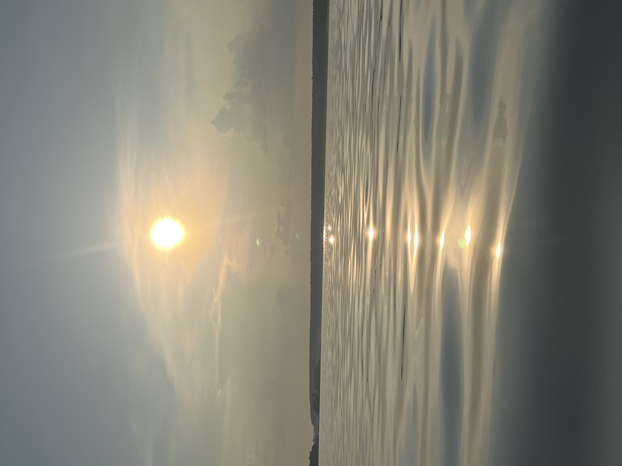 Hazy sunset over a lake outside Borovoe, Russia
