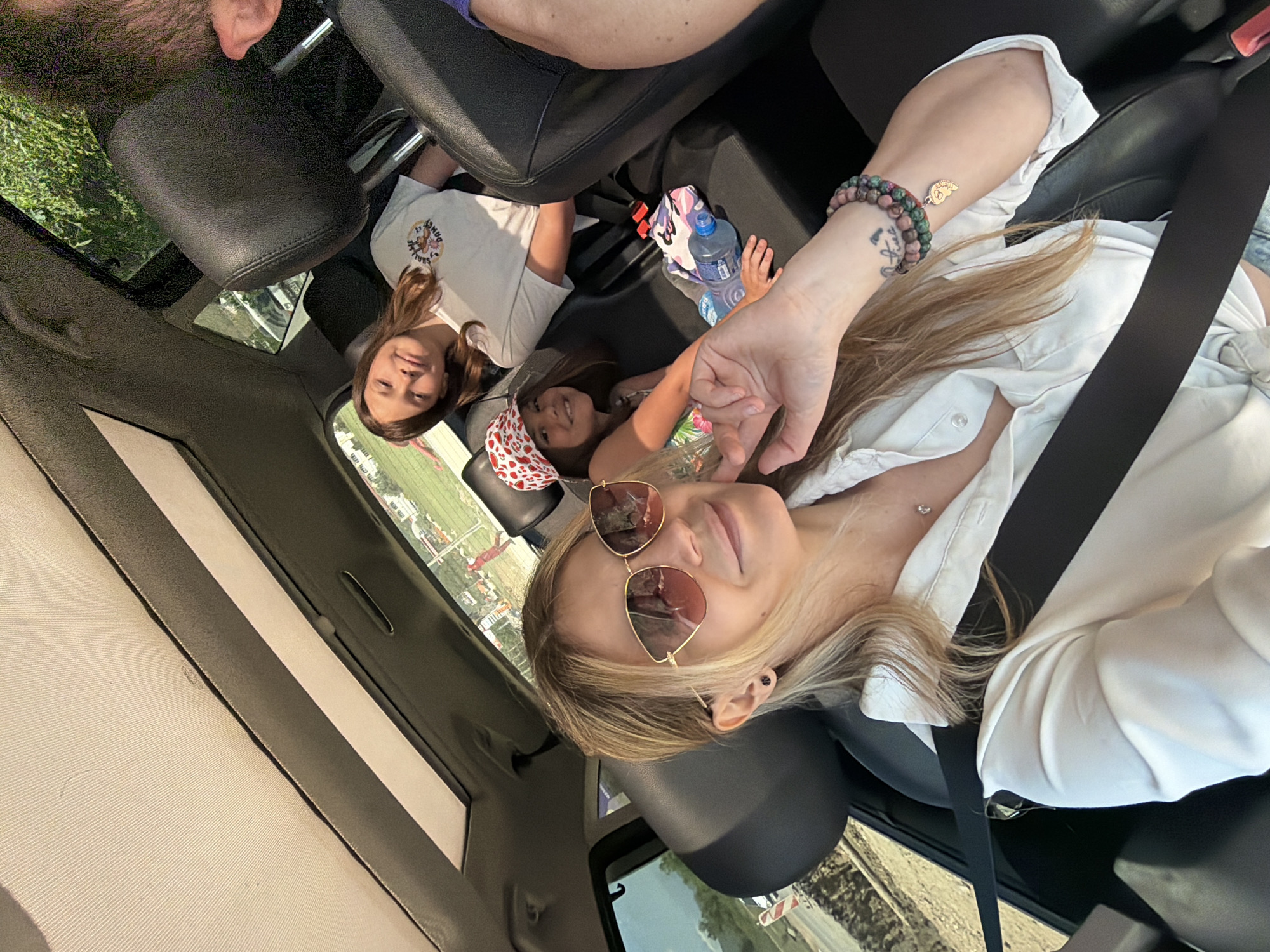 Woman and children travel by car in Montenegro