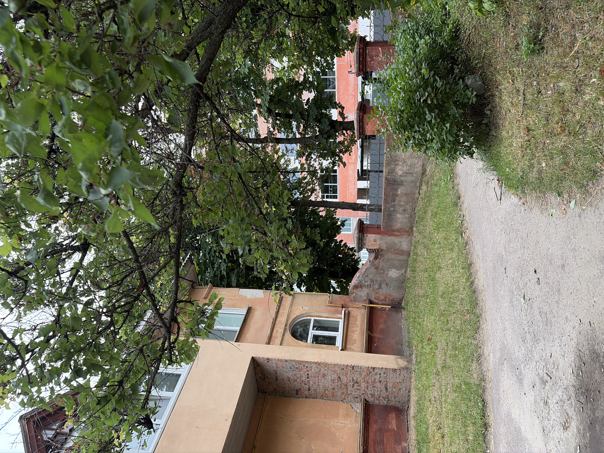 Urban streetscape with brick apartments and a construction site