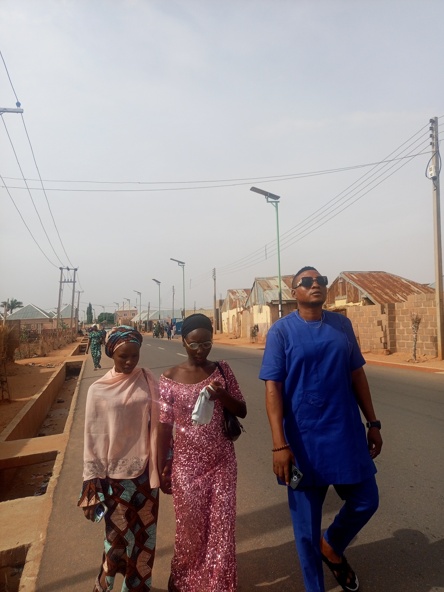 Morning street life unfolds in Tempure, Nigeria residential area