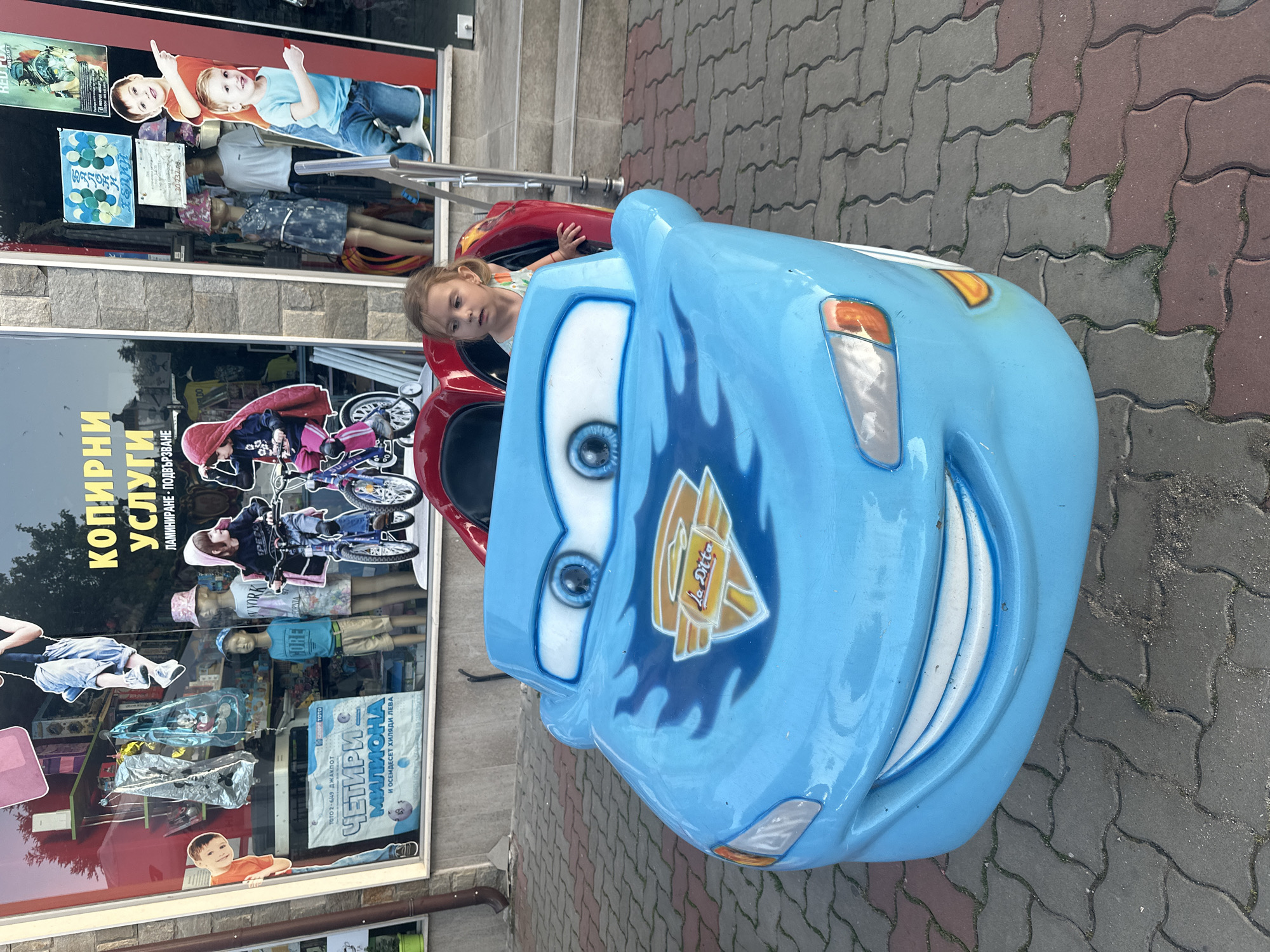 Cartoon car kiddie ride on a Tryavna street