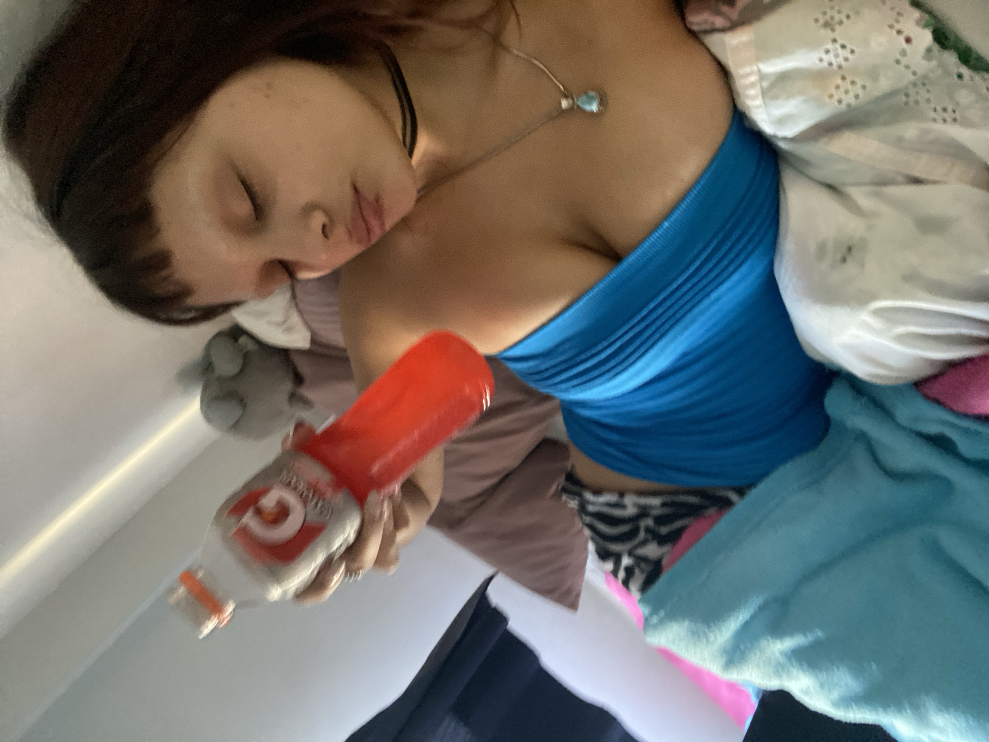 Woman rests with laptop in Buenos Aires bedroom