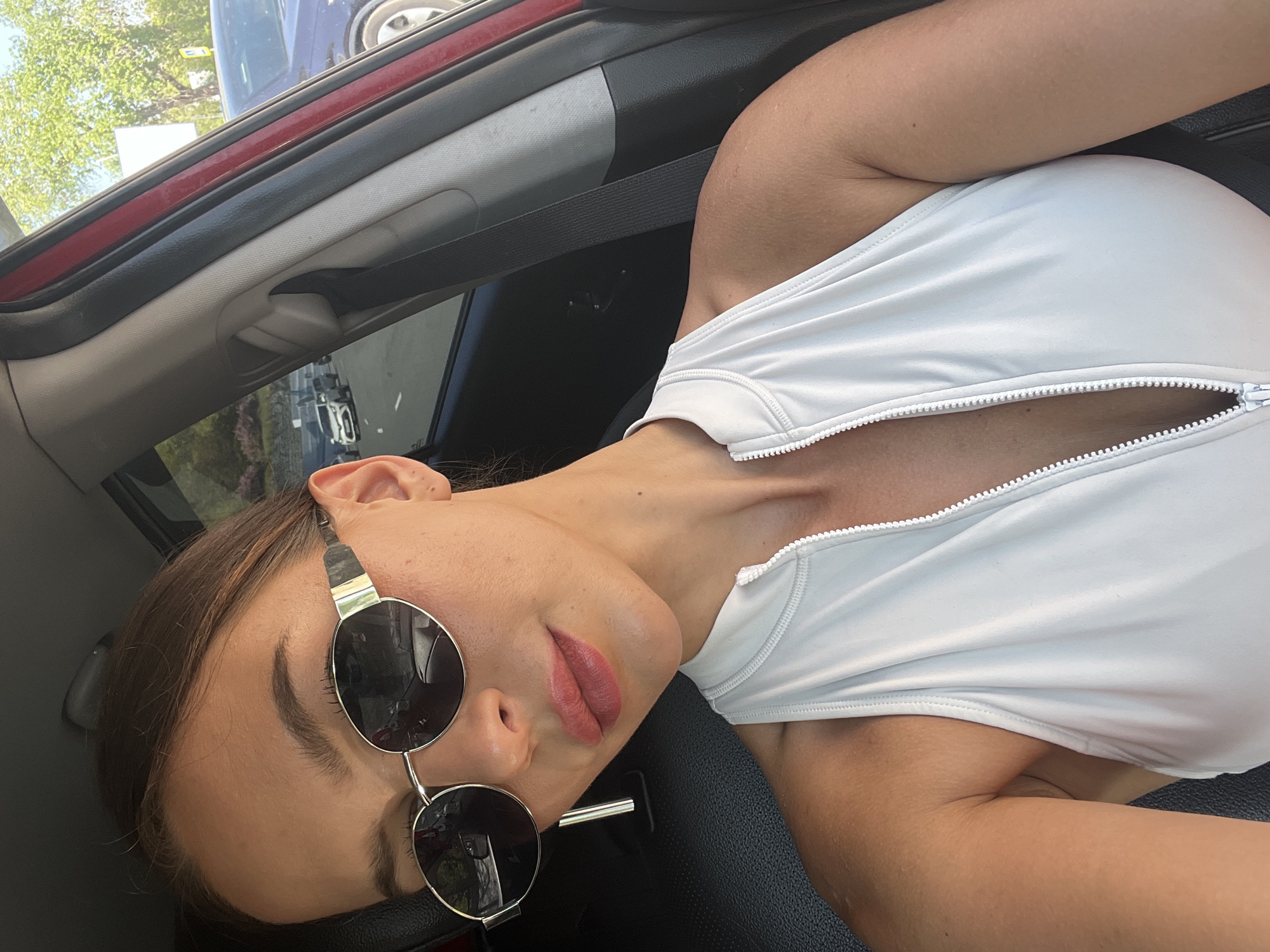 Woman in sunglasses observed in passenger seat, Vladivostok