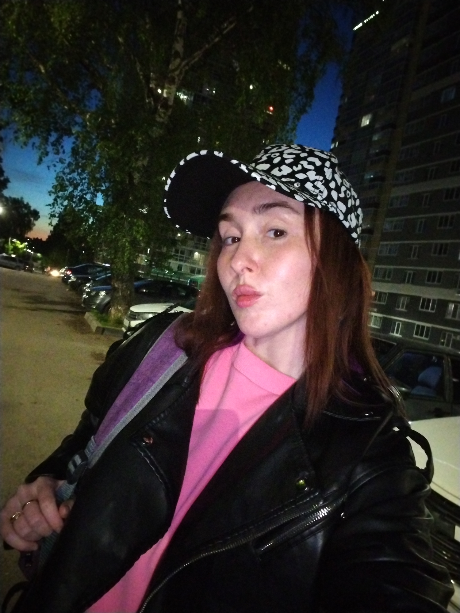Woman documents evening outing in Izhevsk with selfies, city scenes