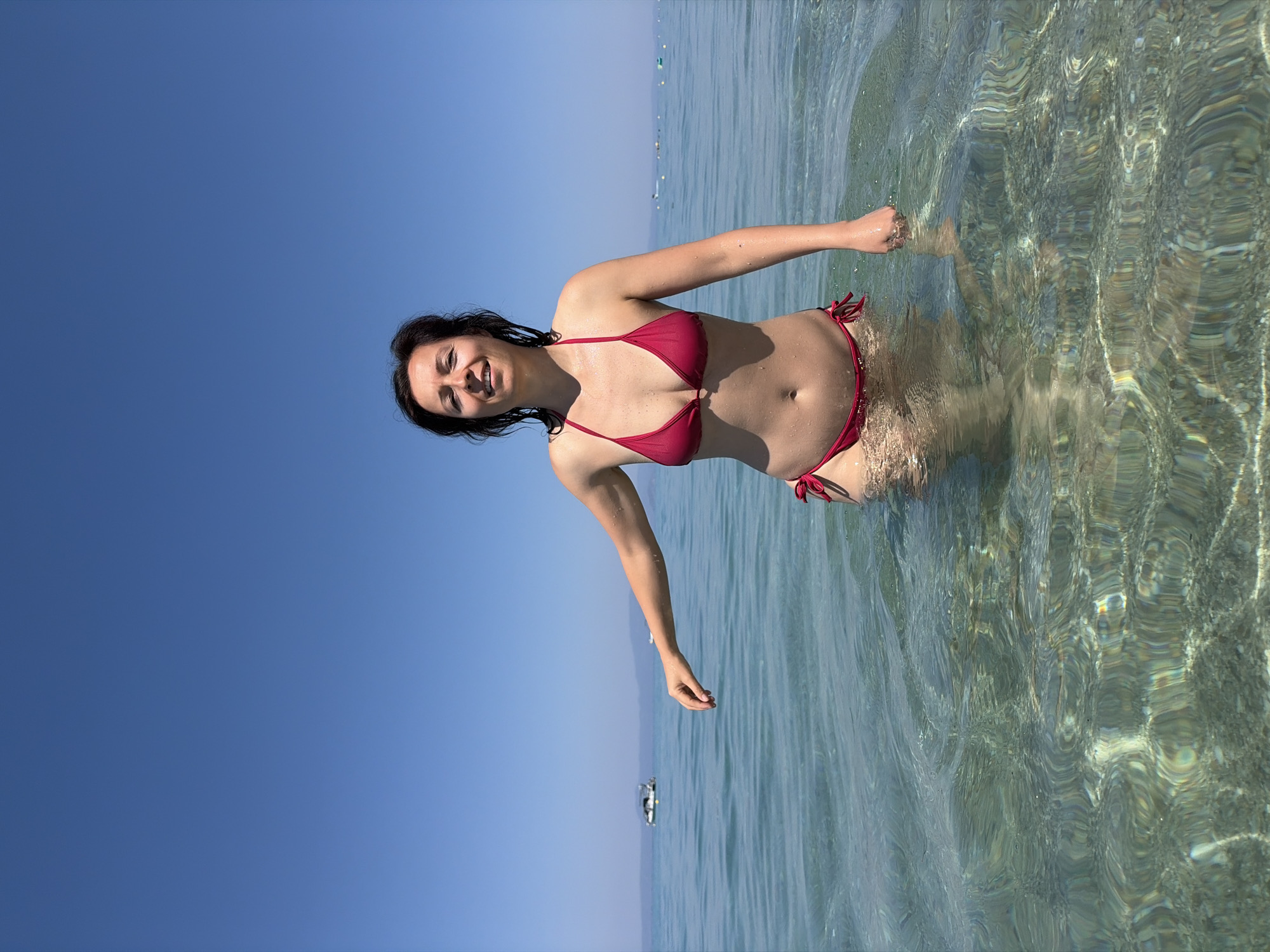 Sunny beach day in shallow Greek coastal waters