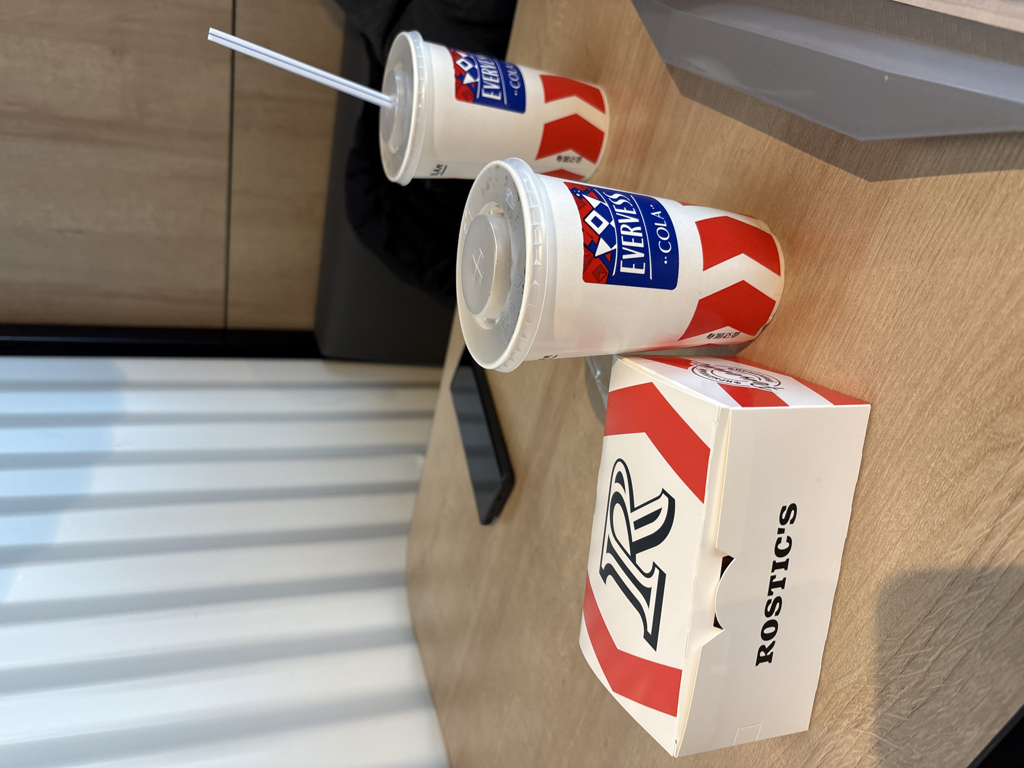 Morning scenes documented in Krasnoyarsk include fast-food meal, woman