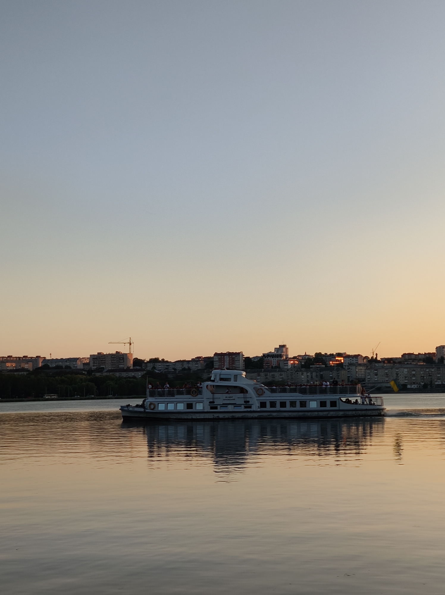 Golden hour at Ternopil Lake, ferry and all