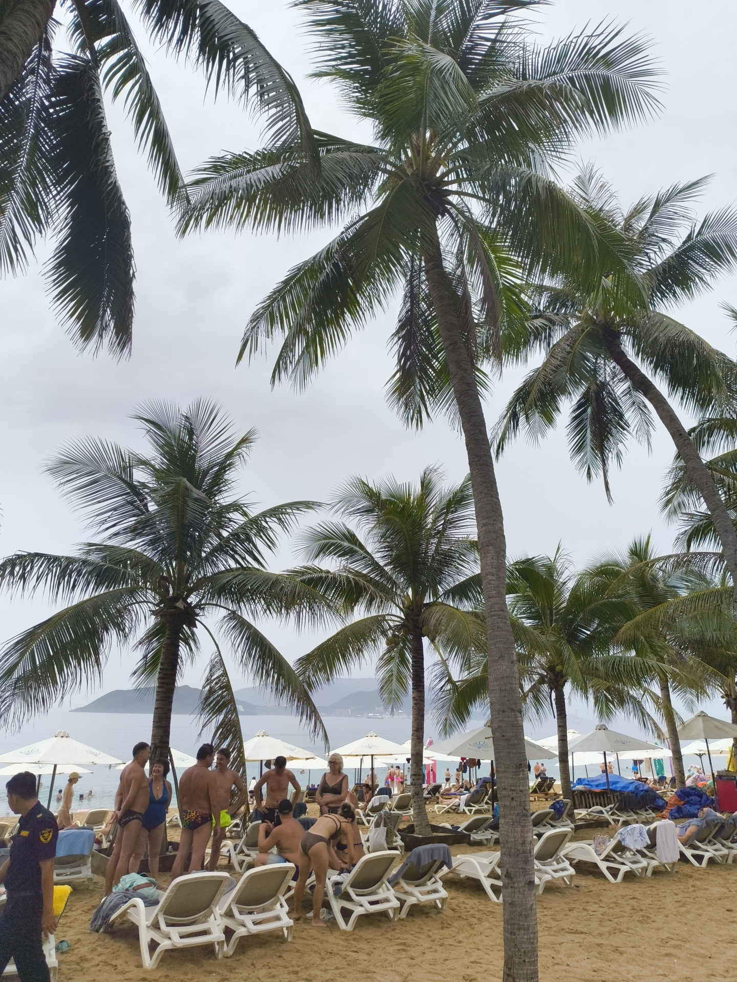 Nha Trang beach on a cloudy morning, busy as usual