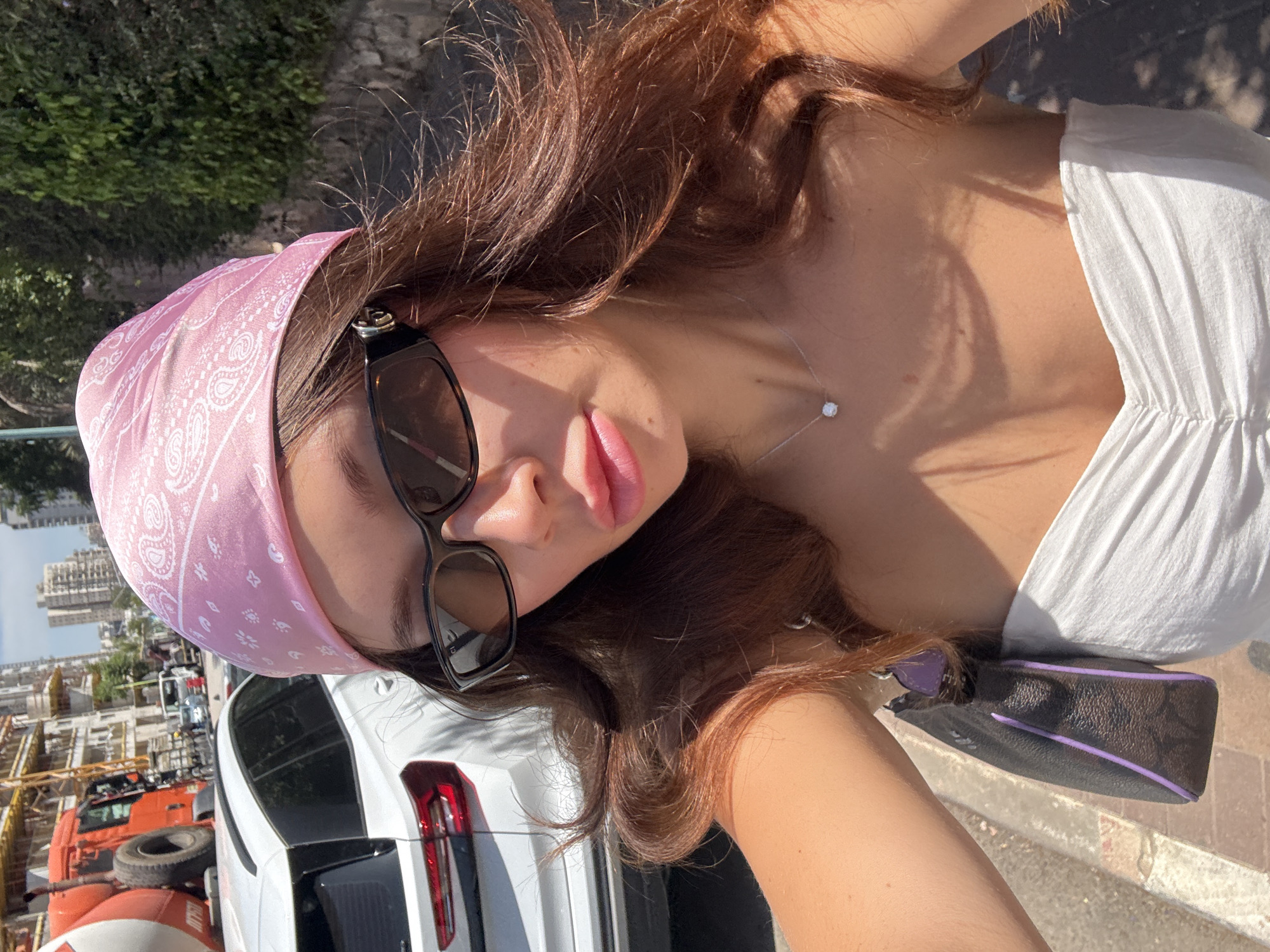 Woman takes tilted selfie in daylight in Petah Tikva