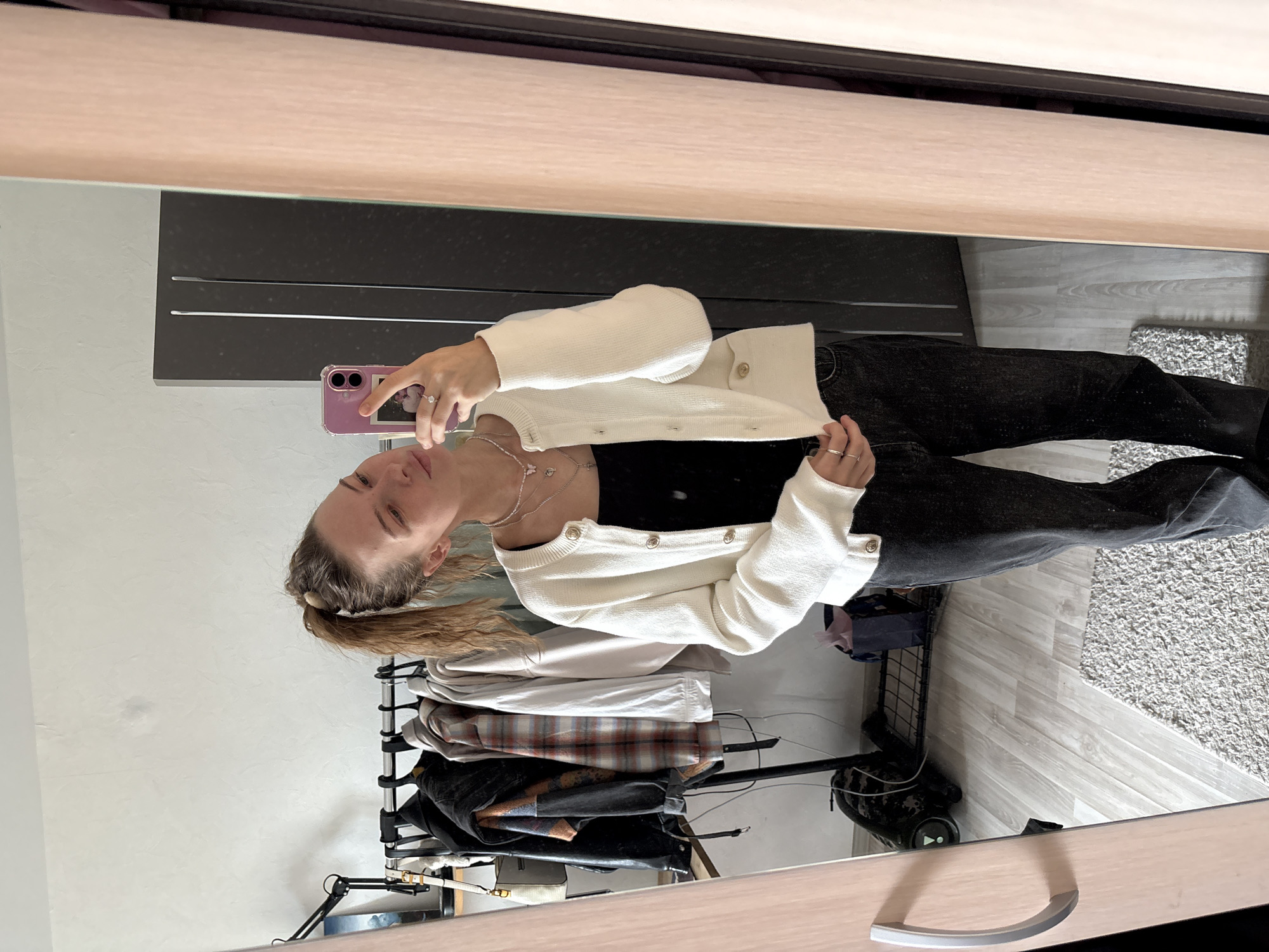 Mirror selfie session trying out hairstyles in Perm apartment