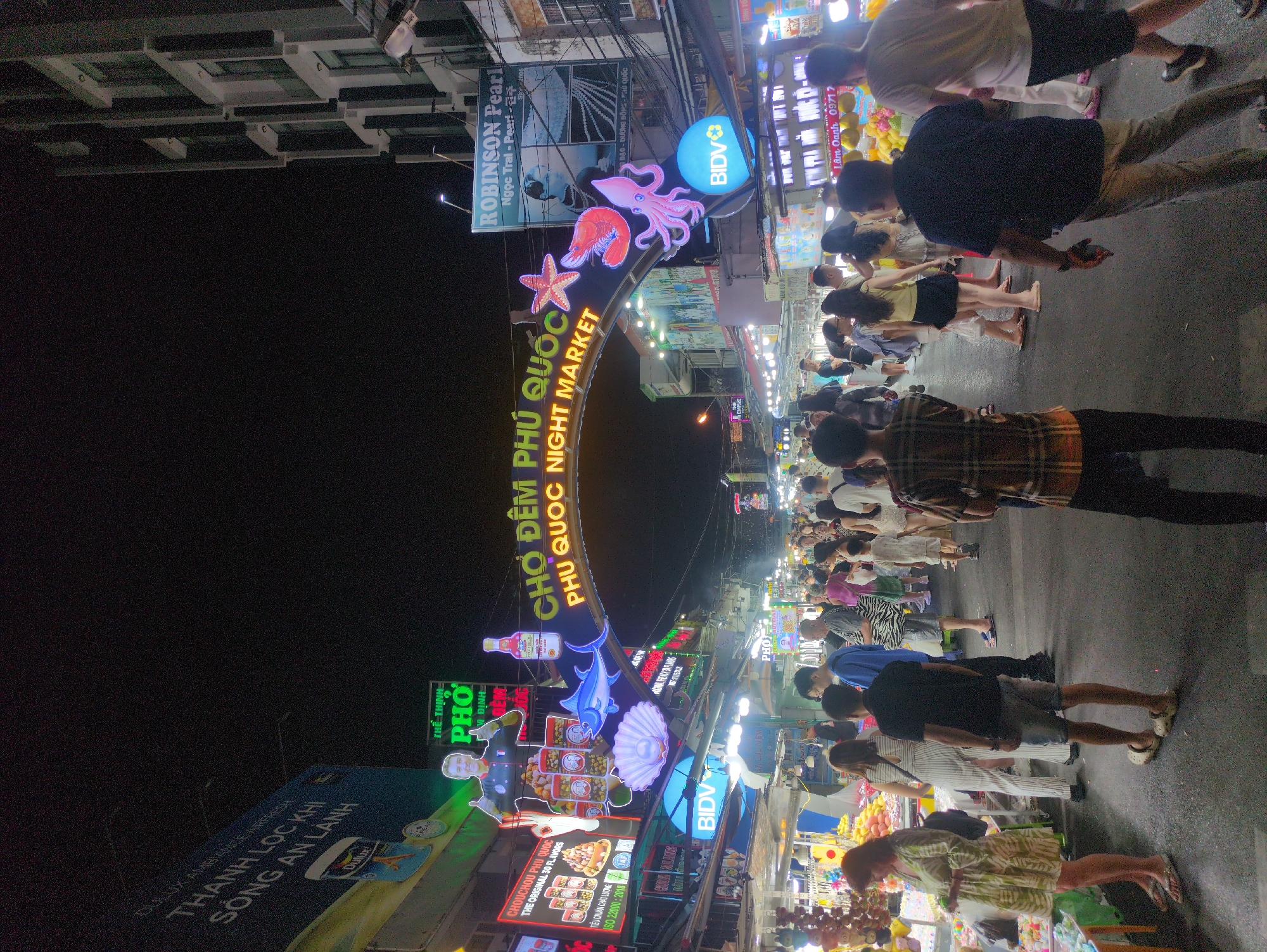 Evening crowds visit Phú Quốc Night Market, hotel district bustling