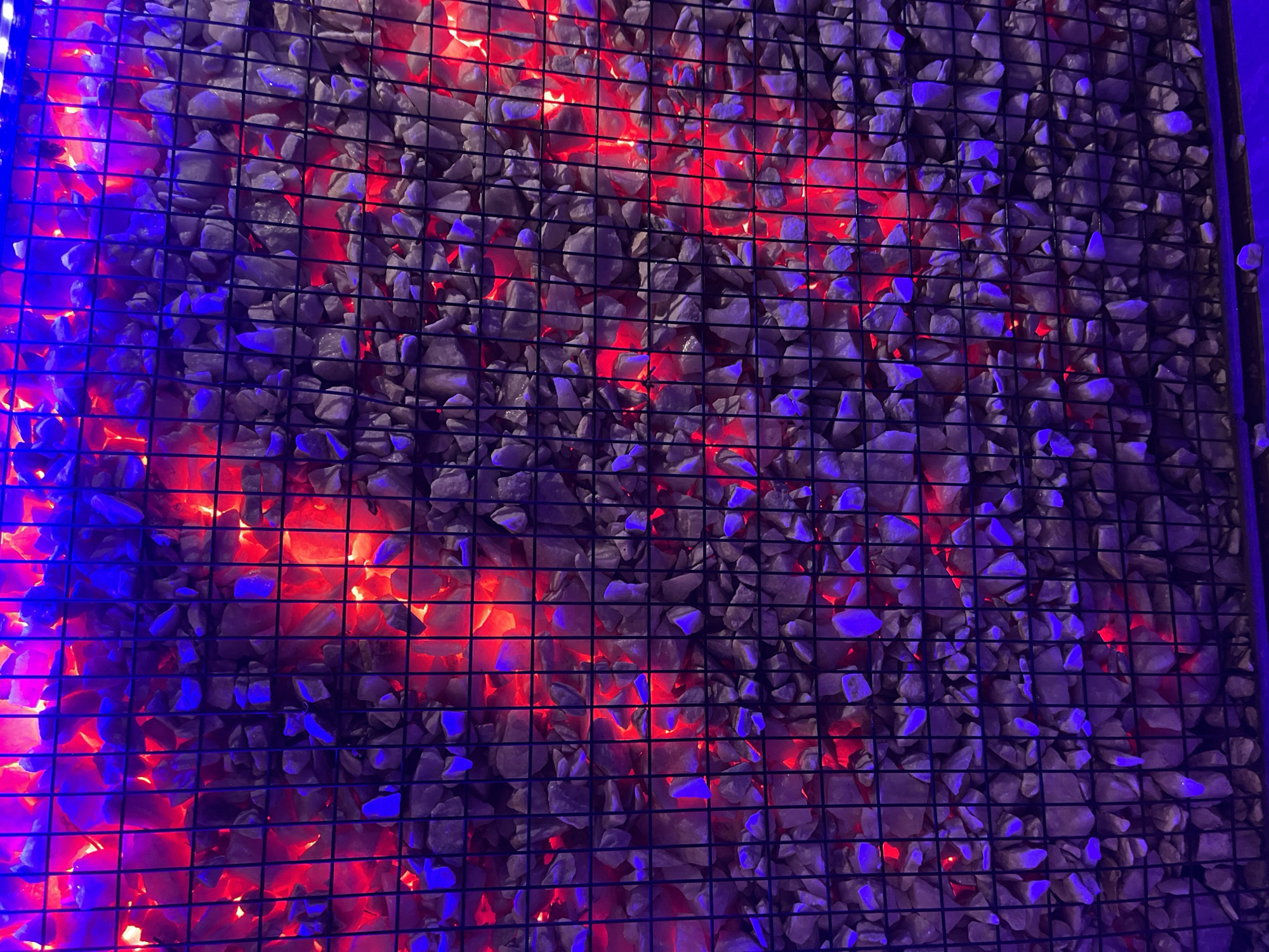 Nighttime scenes captured in Jos show illuminated wall, quiet street