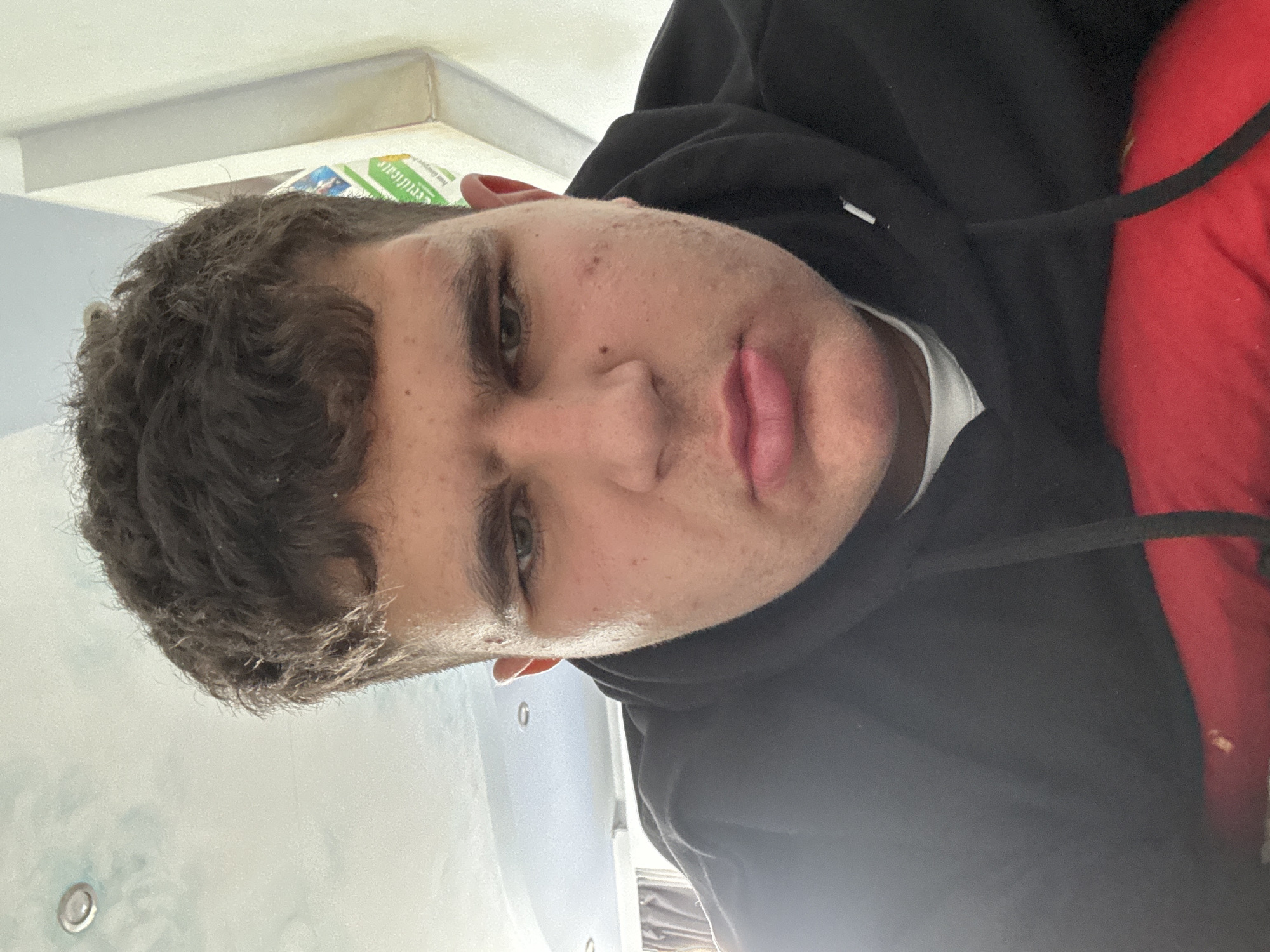 Person photographed in Kazanlak wearing black hoodie