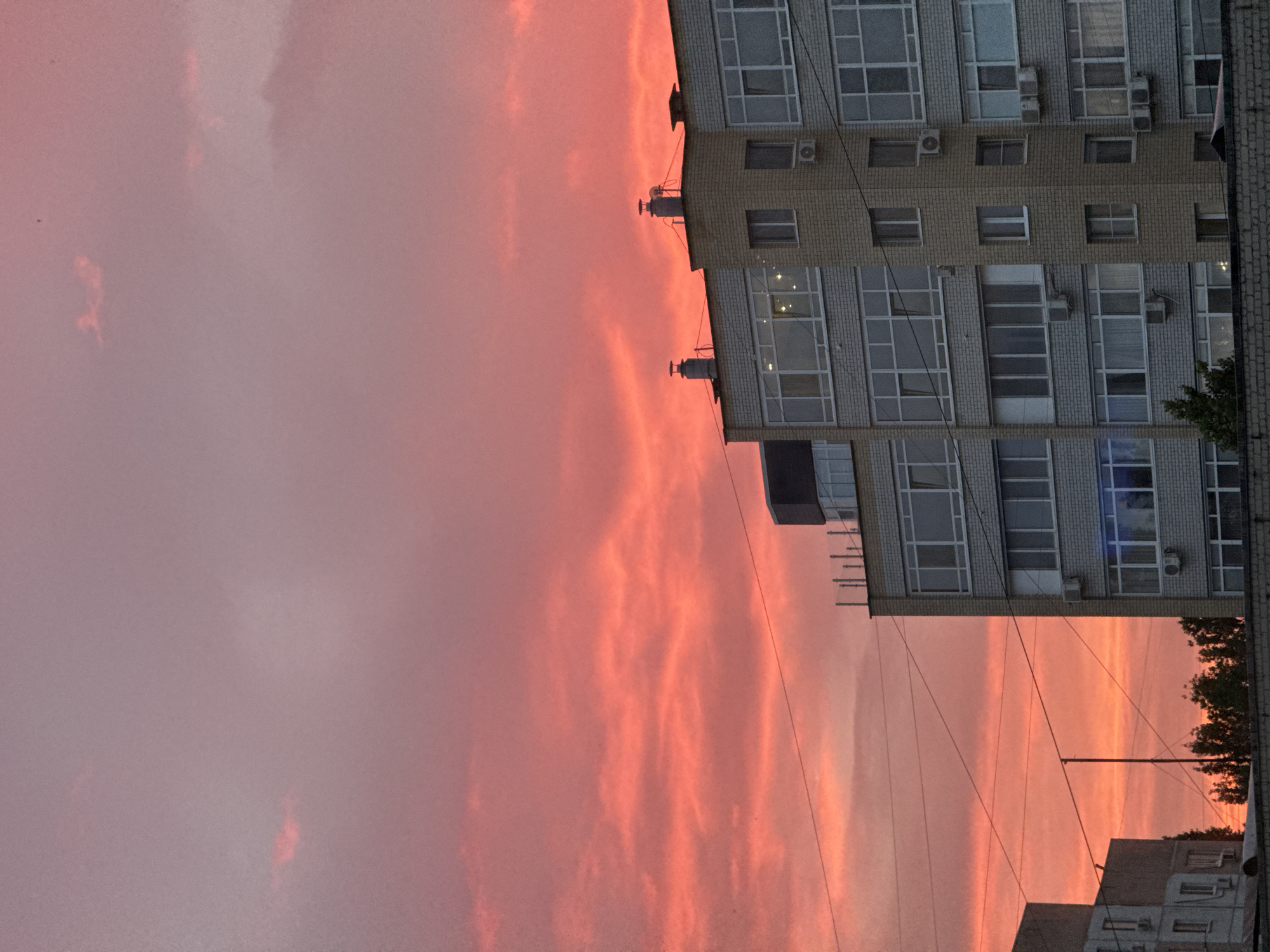Vivid summer sunset over Saratov apartment rooftops