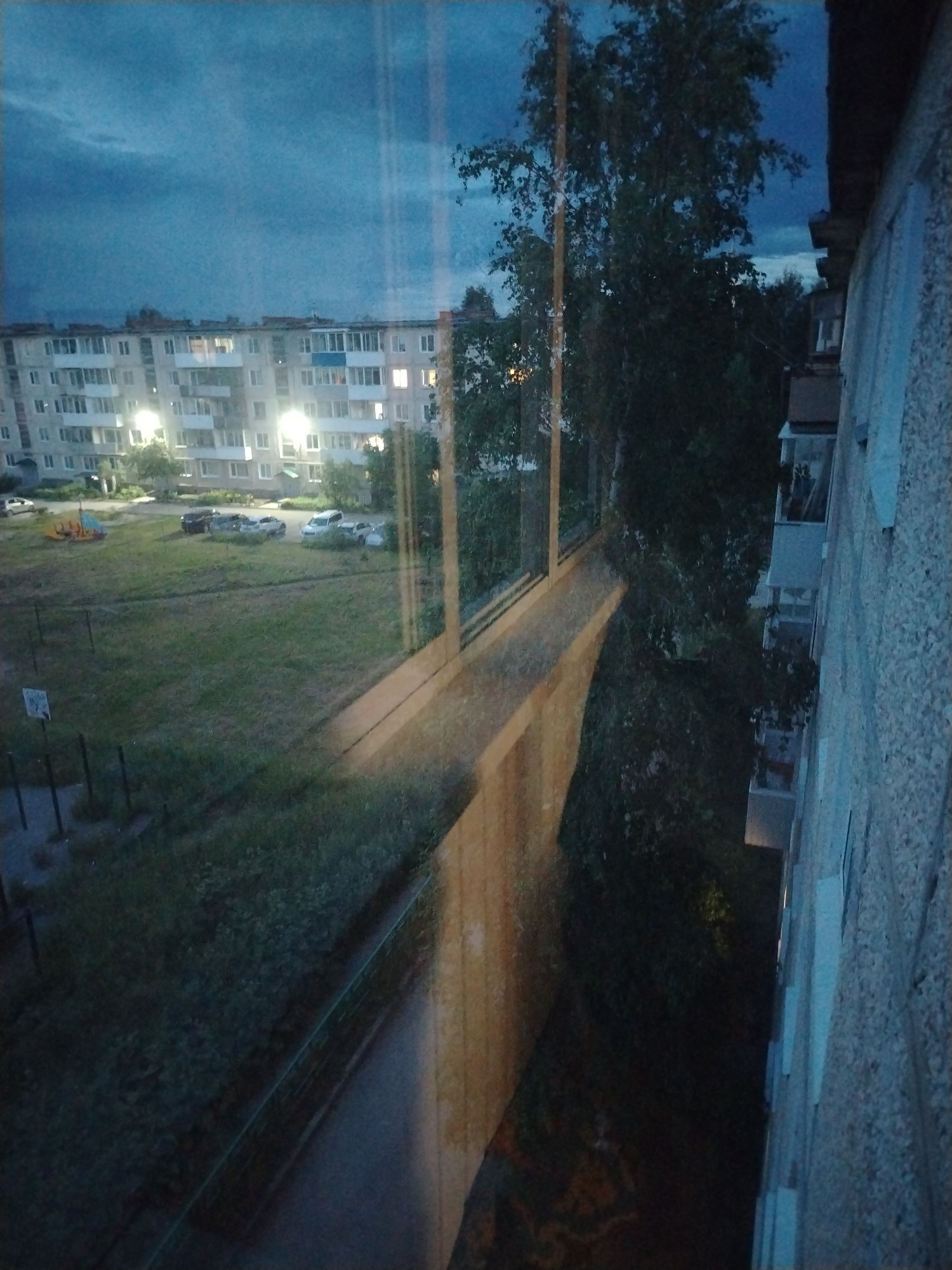 Dusk over a Soviet-style apartment neighborhood, with abstract interludes