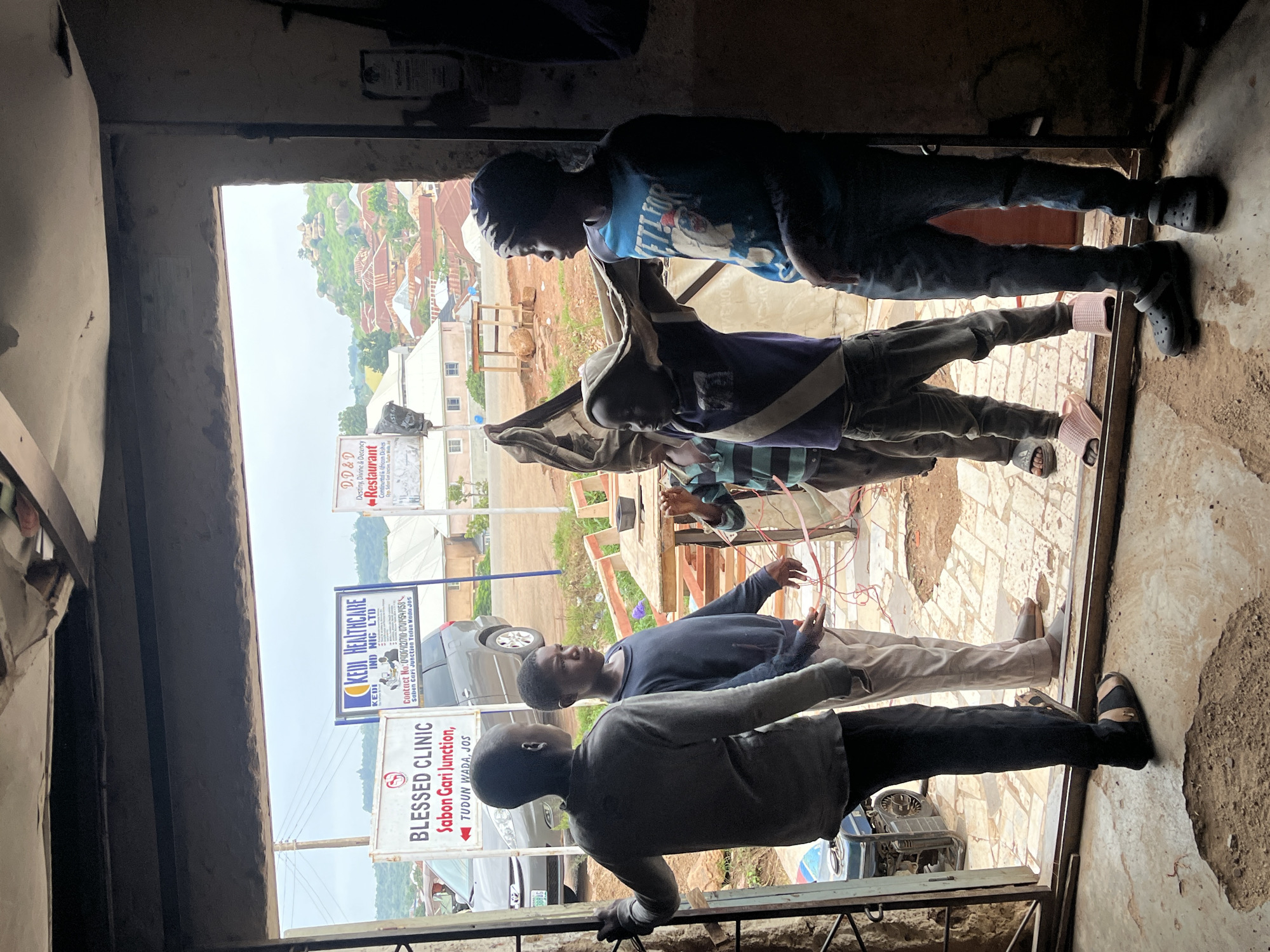 Street life and small commerce at a Jos, Nigeria corner
