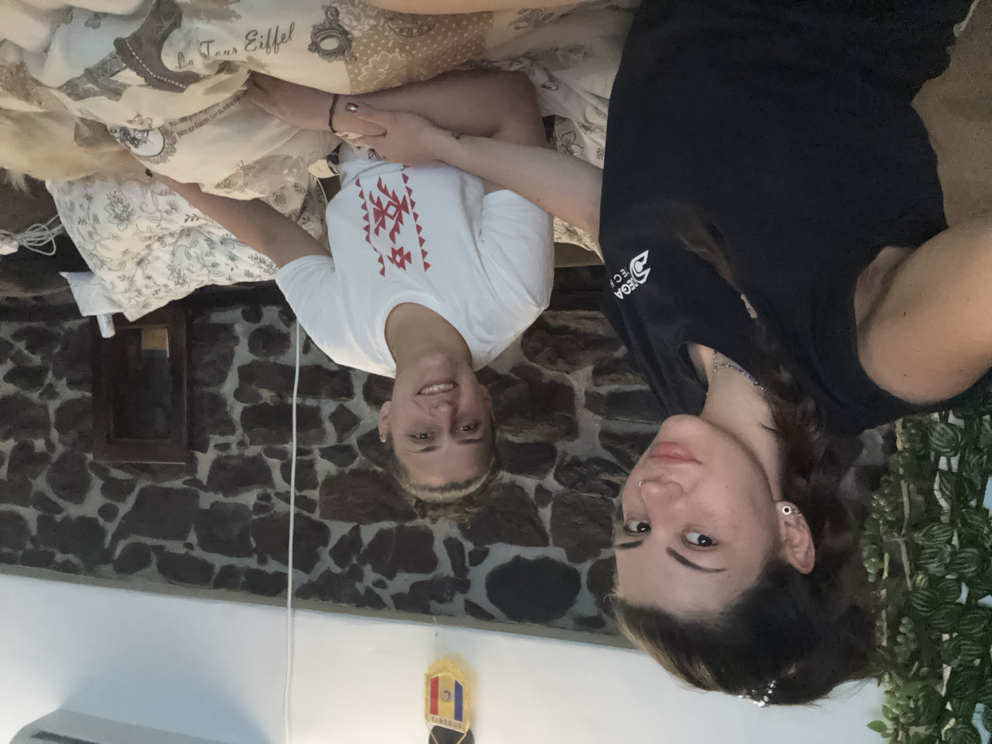 Two women rest indoors in Belopoptsi, Bulgaria room