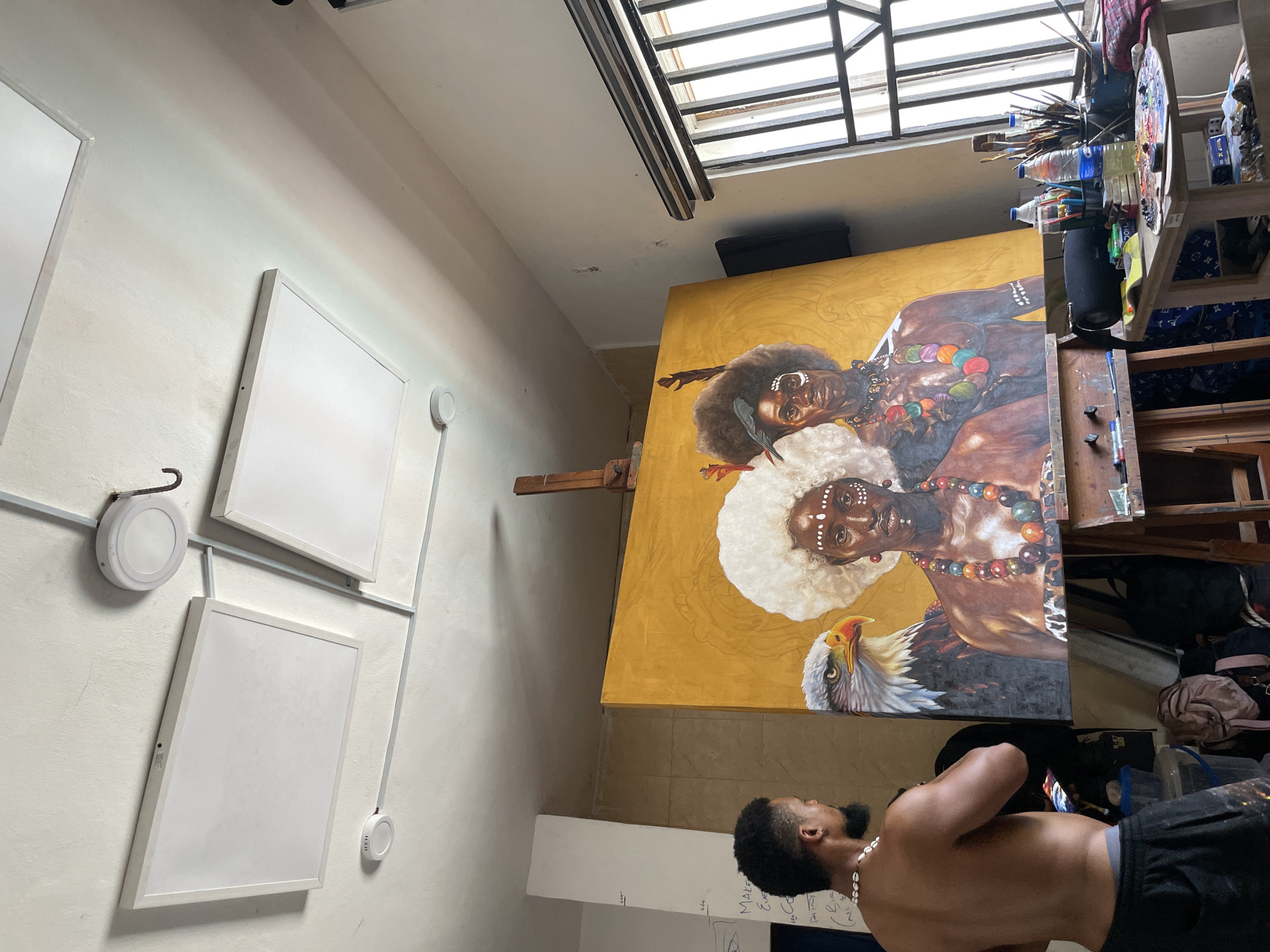 Artist creates tribal portrait painting in Ado studio