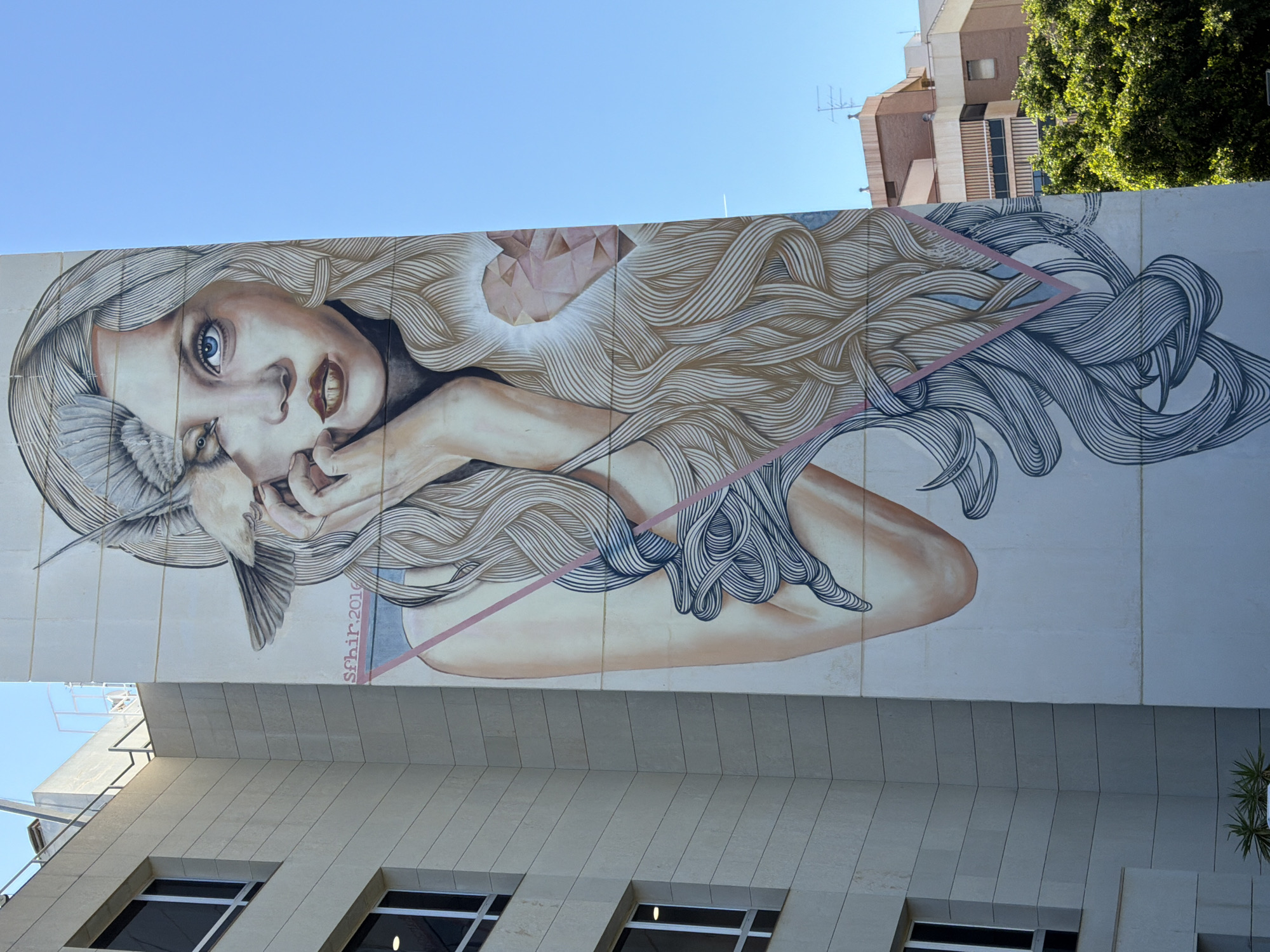Witness documents urban mural and pyramid building architecture
