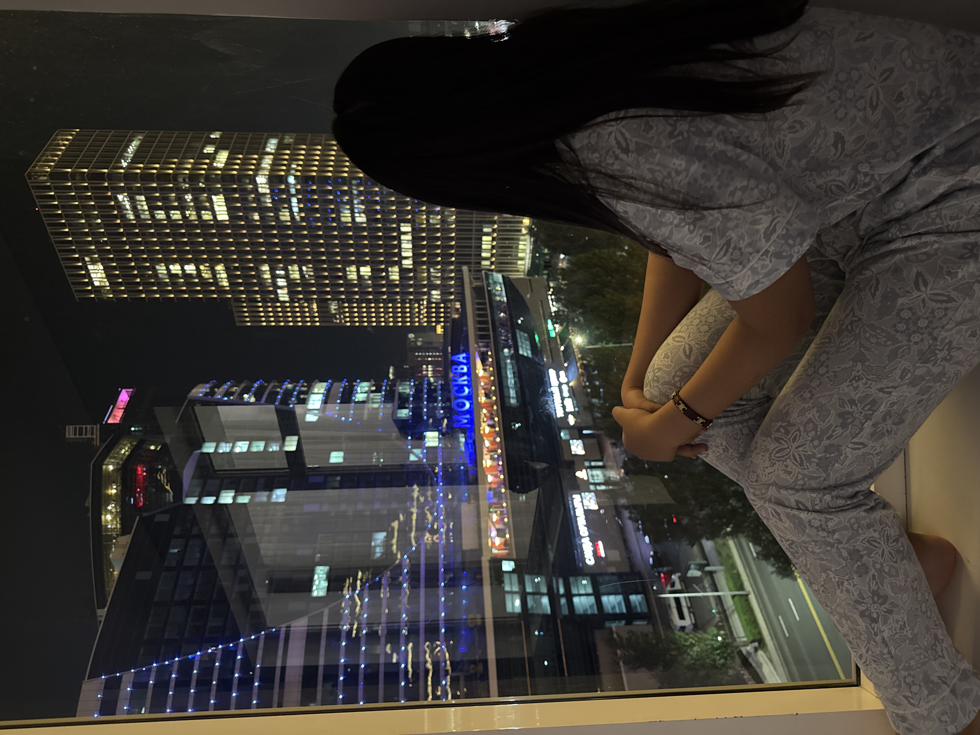Night in Astana: city skyline views from a high-rise window