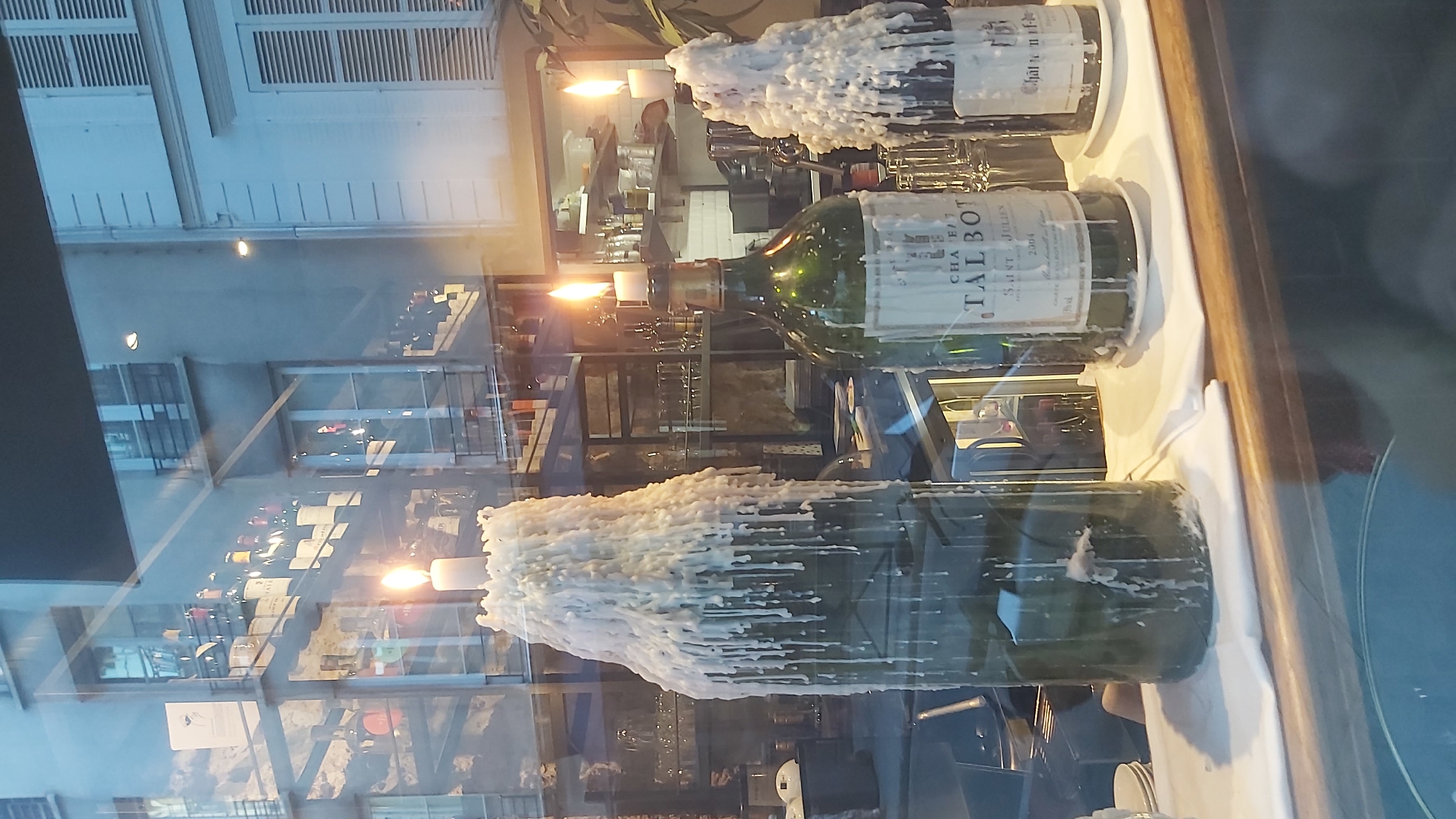 Evening street life around a lively Paris restaurant block