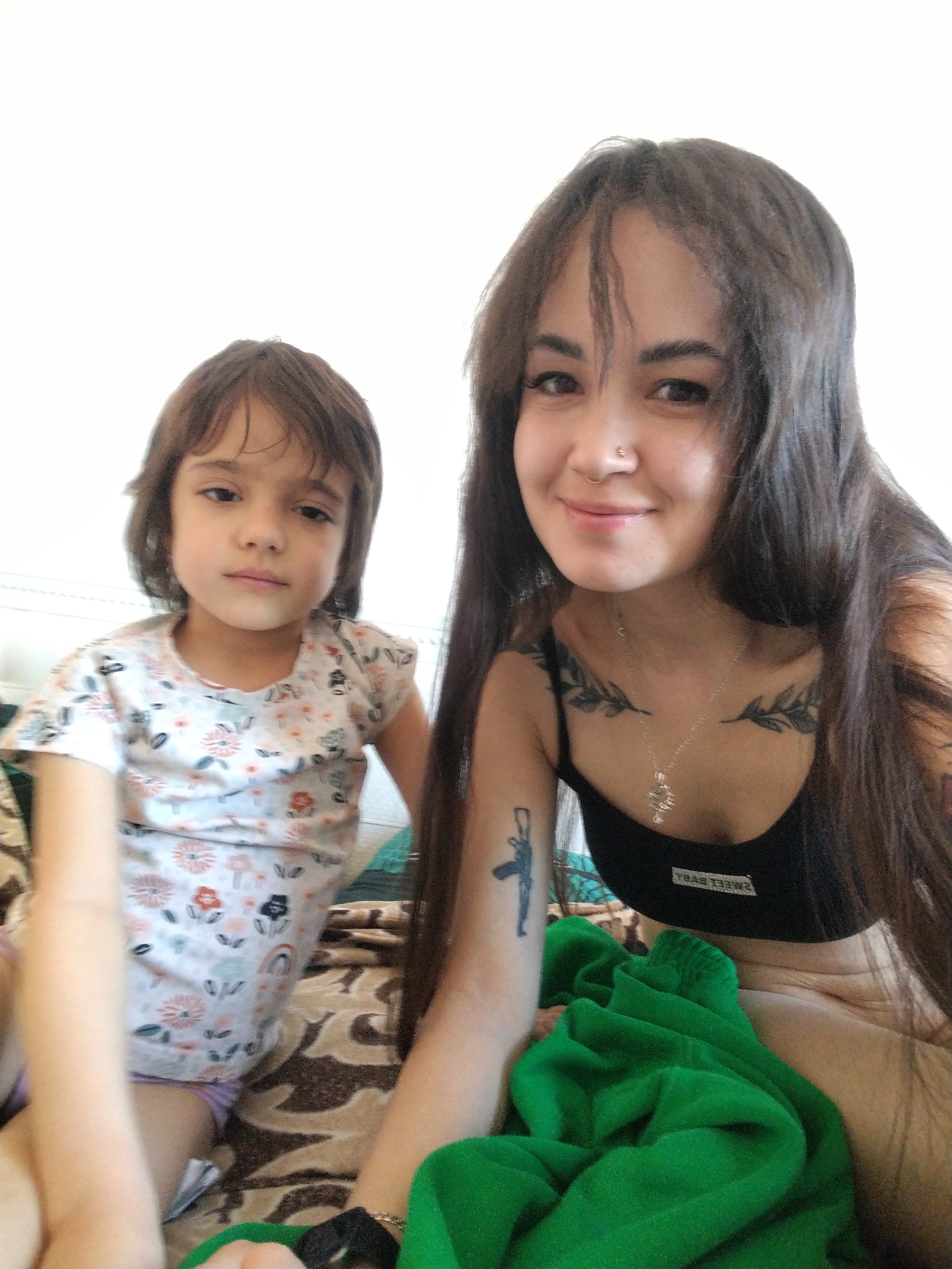 Woman and child share quiet indoor moment together