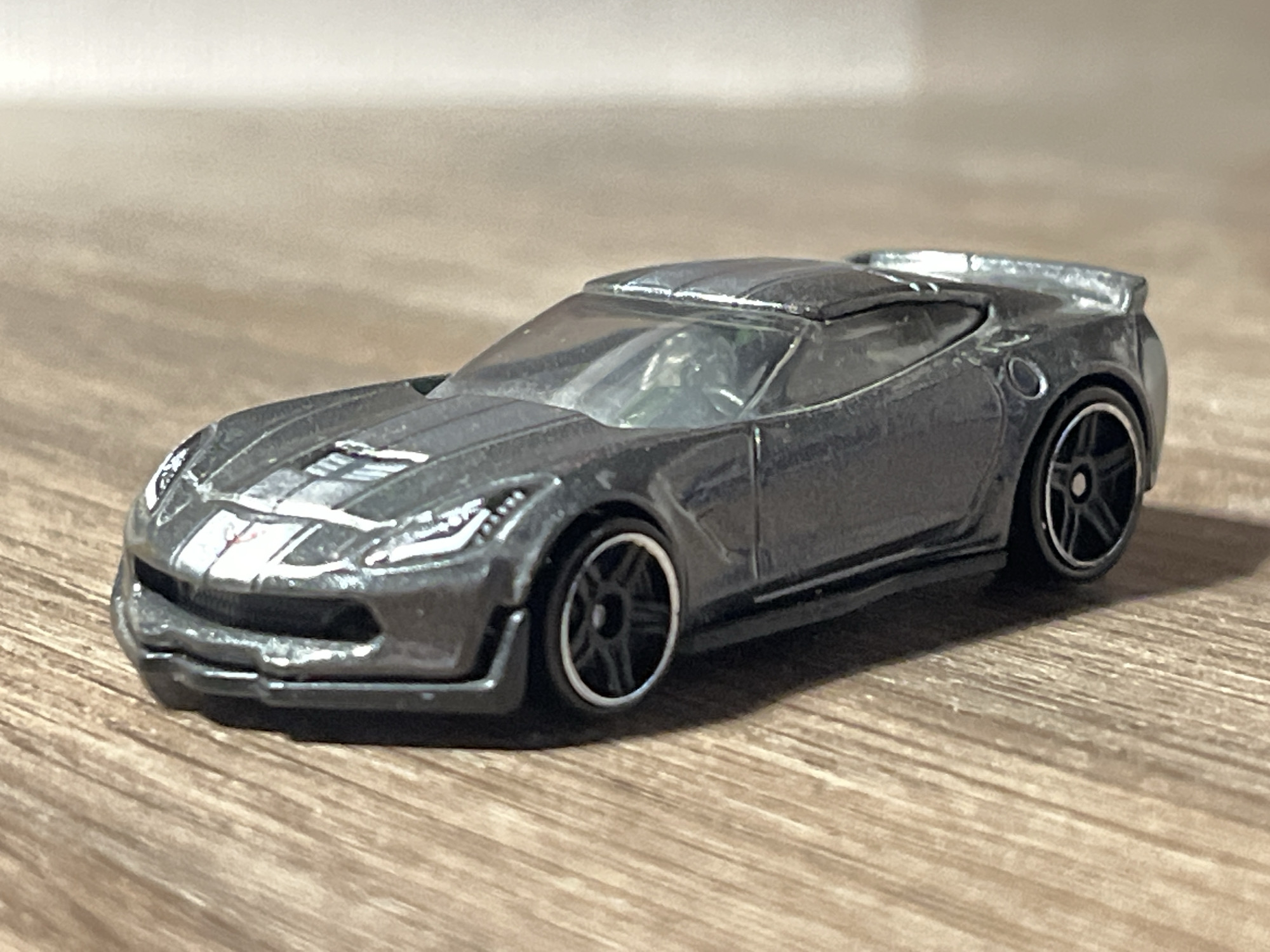 Die-cast toy car collection photographed in a Belarusian home setting