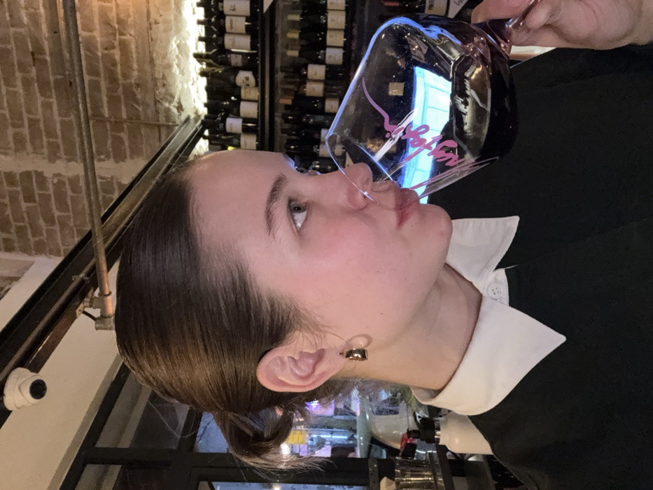 Woman enjoys wine at Tel Aviv beverage establishment