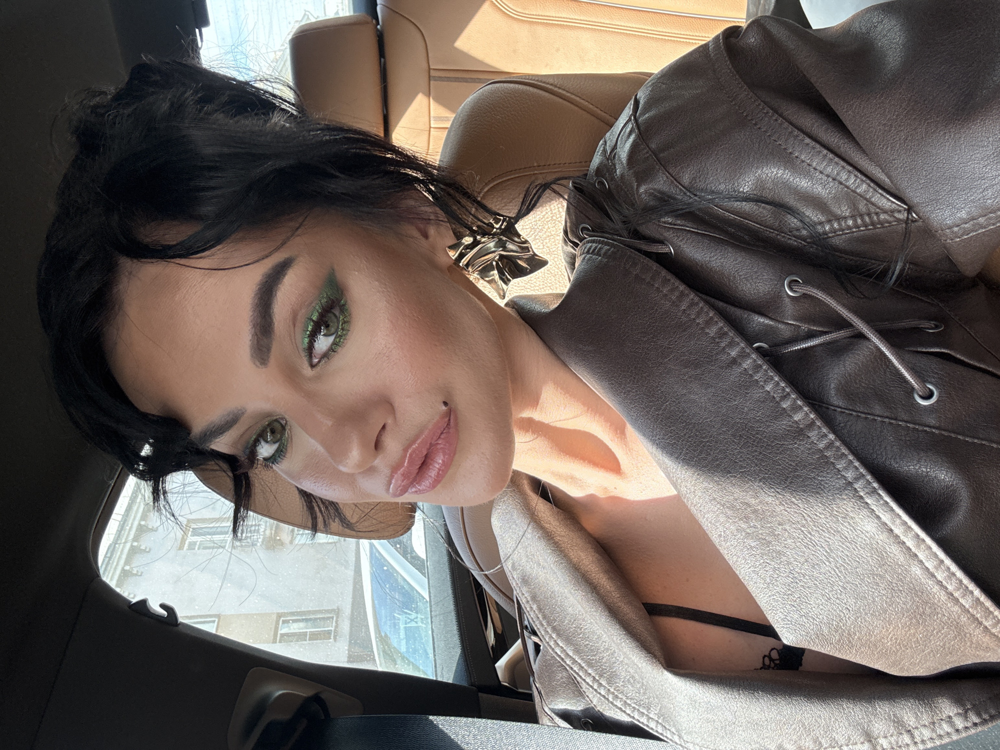 Woman takes selfie inside car in Krasnoyarsk