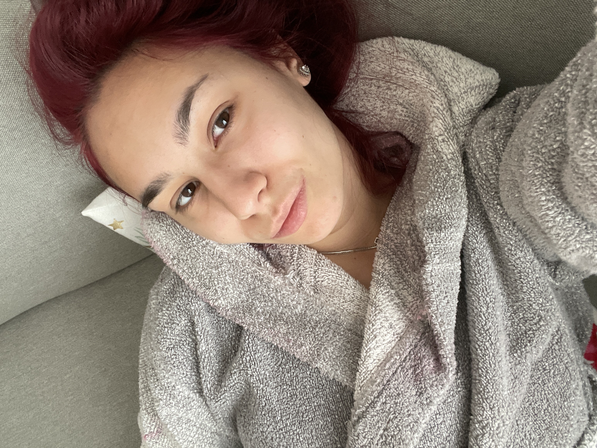Woman rests on couch in Bulgarian home