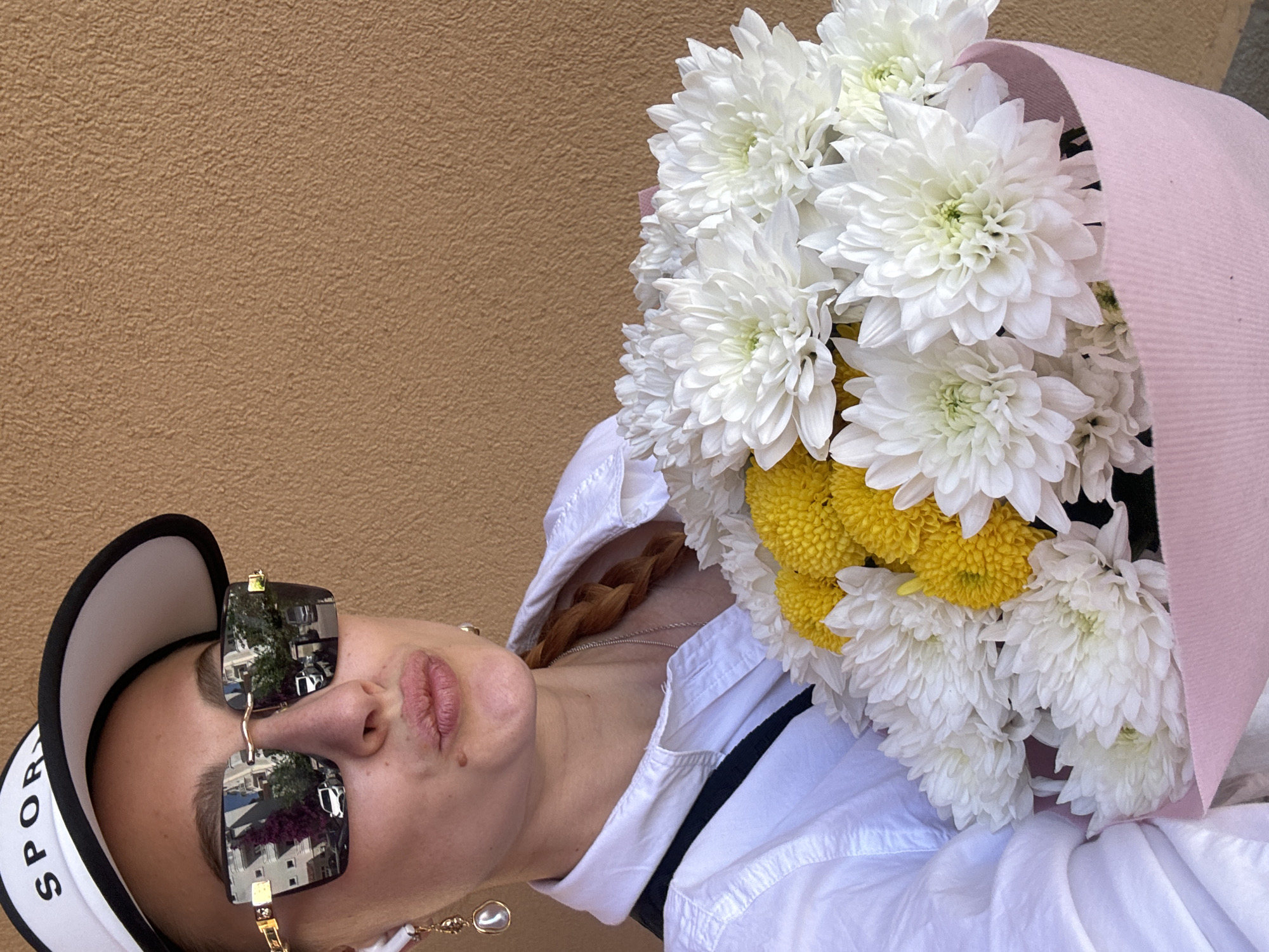 Woman with flower bouquet photographed in Budva, Montenegro