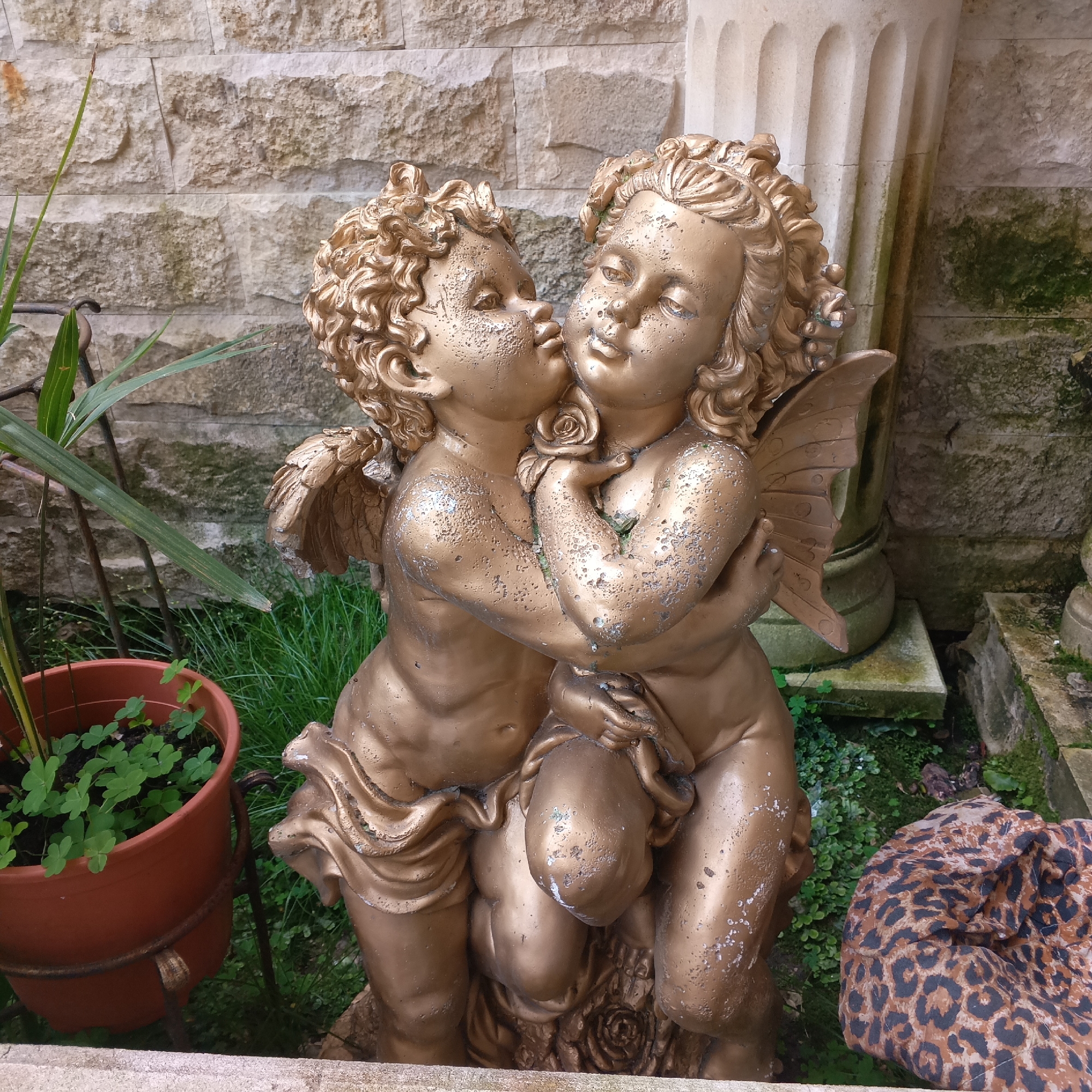 Tourist documents ornamental statues in Sochi-Dagomys garden areas