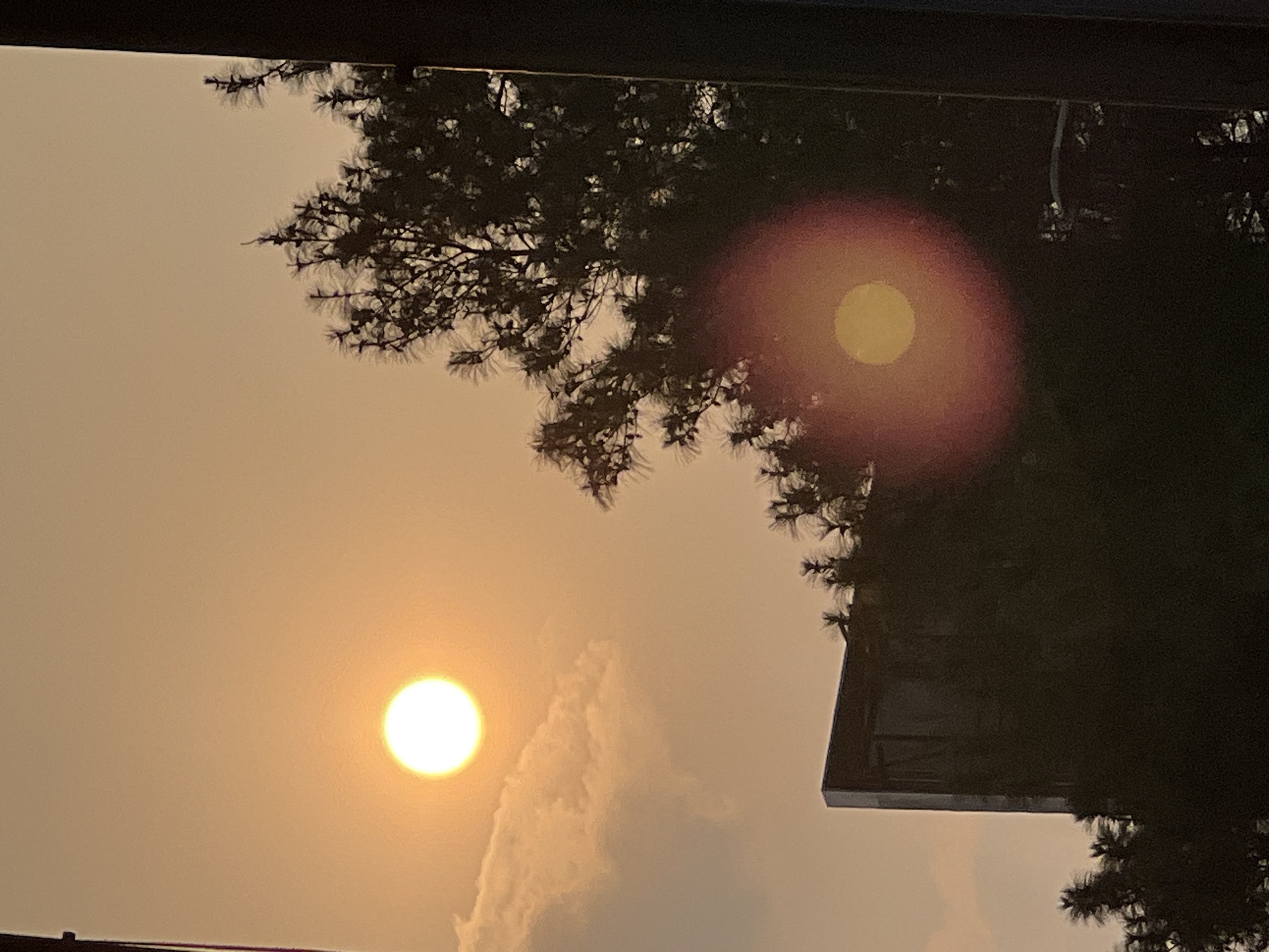 Hazy orange sunset over Bandung City traffic