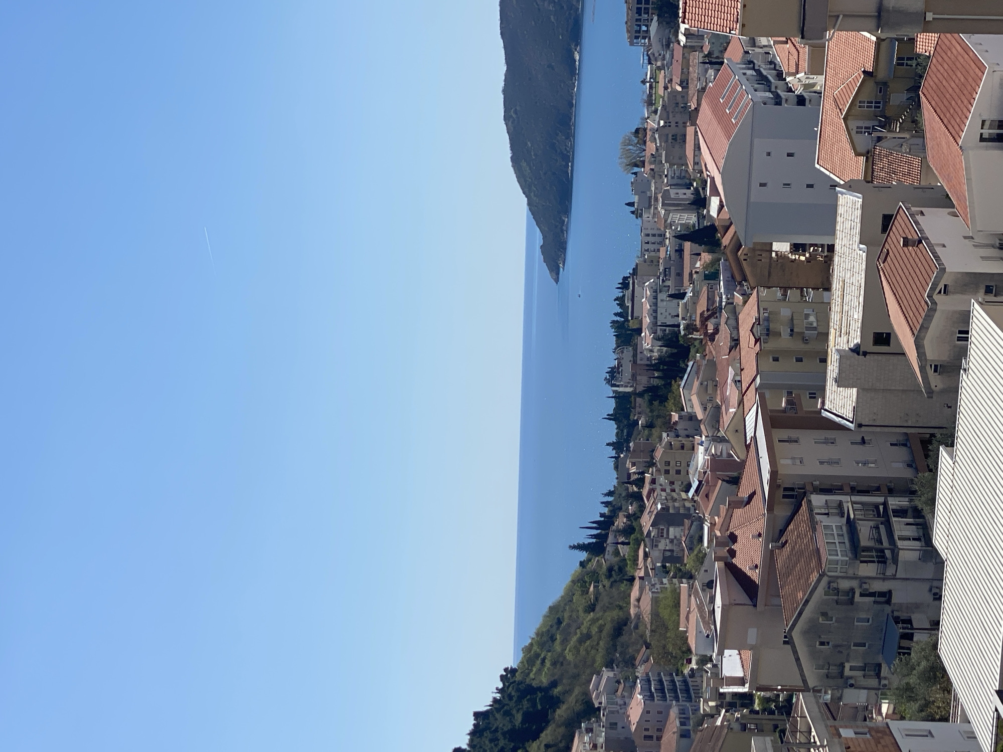 Aerial views document Budva's coastal cityscape from above