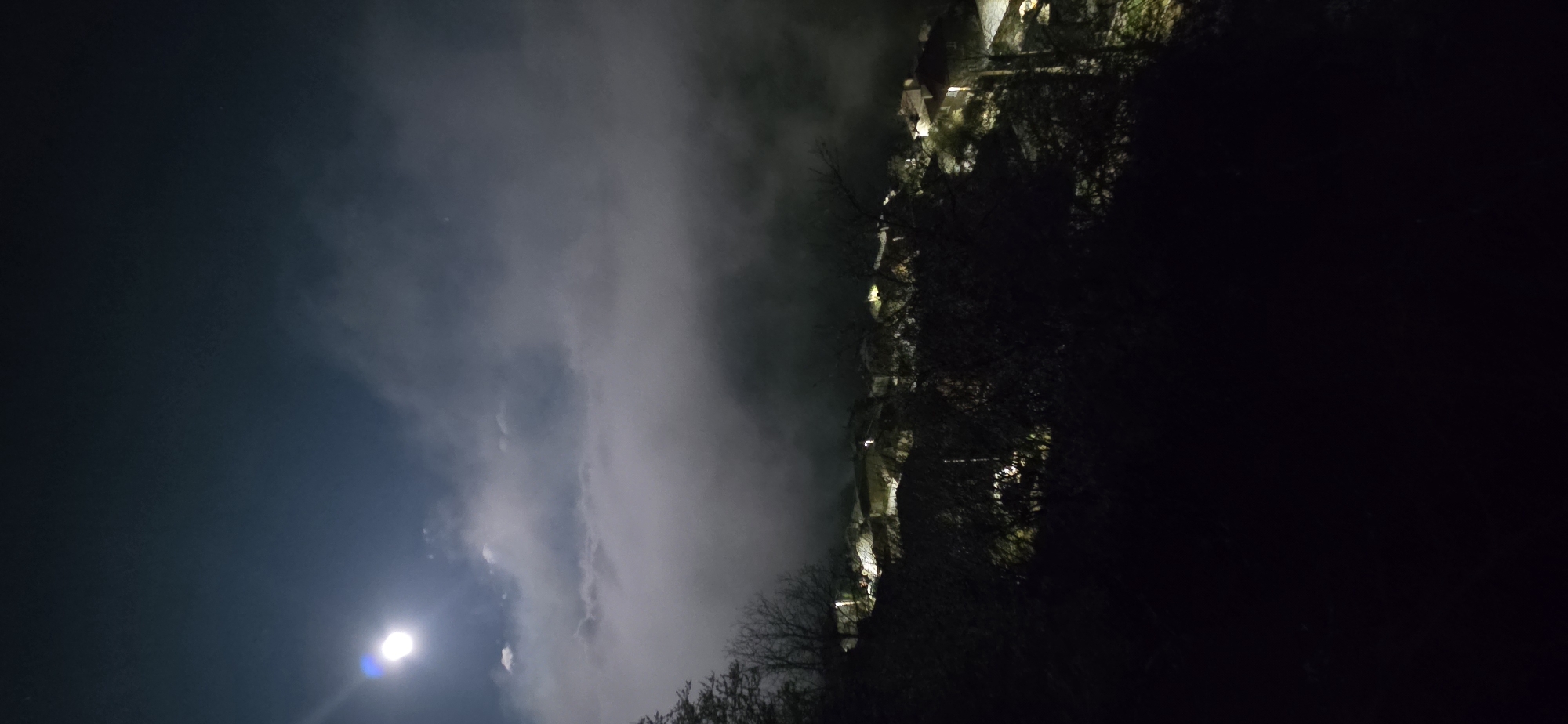 Bright moon observed through clouds in Breze, Bulgaria