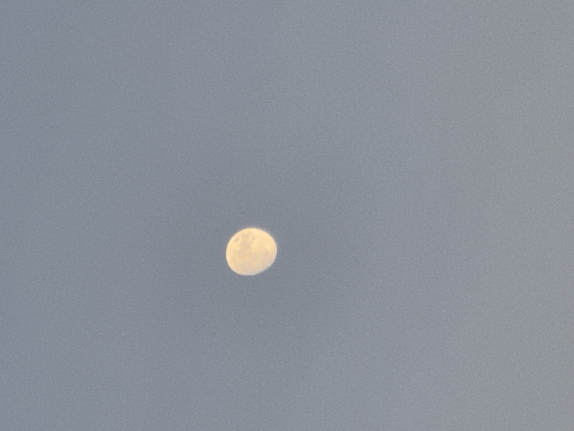 Dusk along the Platja d'Aro beachfront, moon rising over the Costa Brava