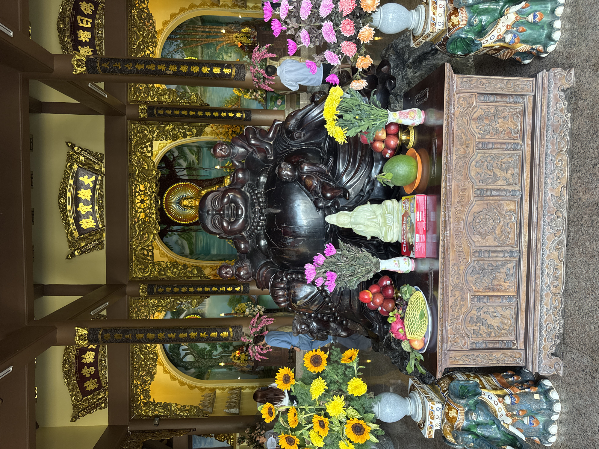 Buddhist temple altars in Da Nang, golden and wooden Buddhas