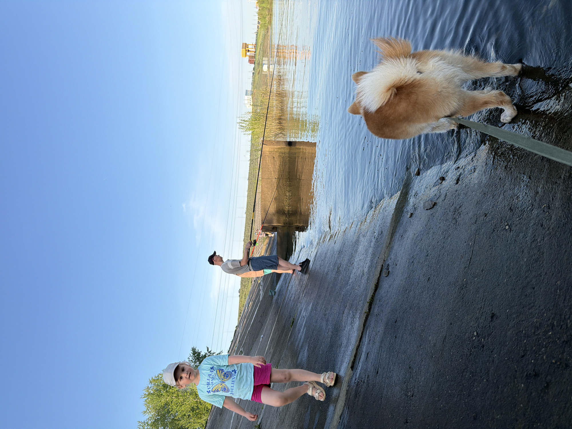 Families enjoy afternoon fishing outing along Kama River in Chaikovsky