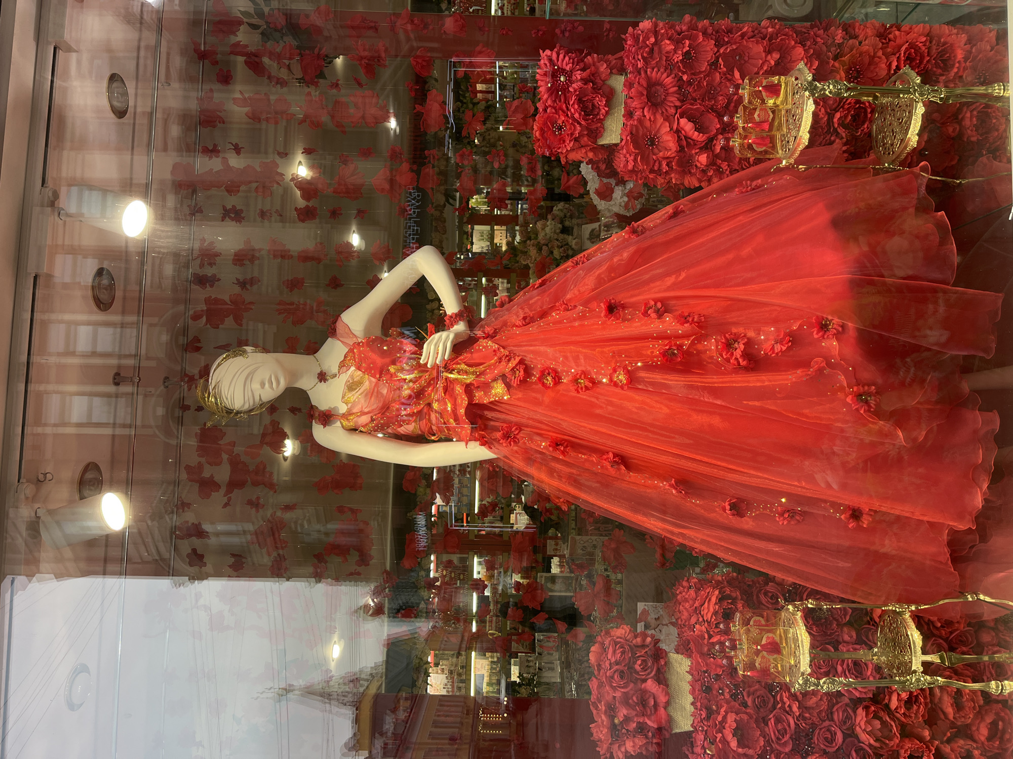 Moscow scenes: bronze statue, red dress window display observed