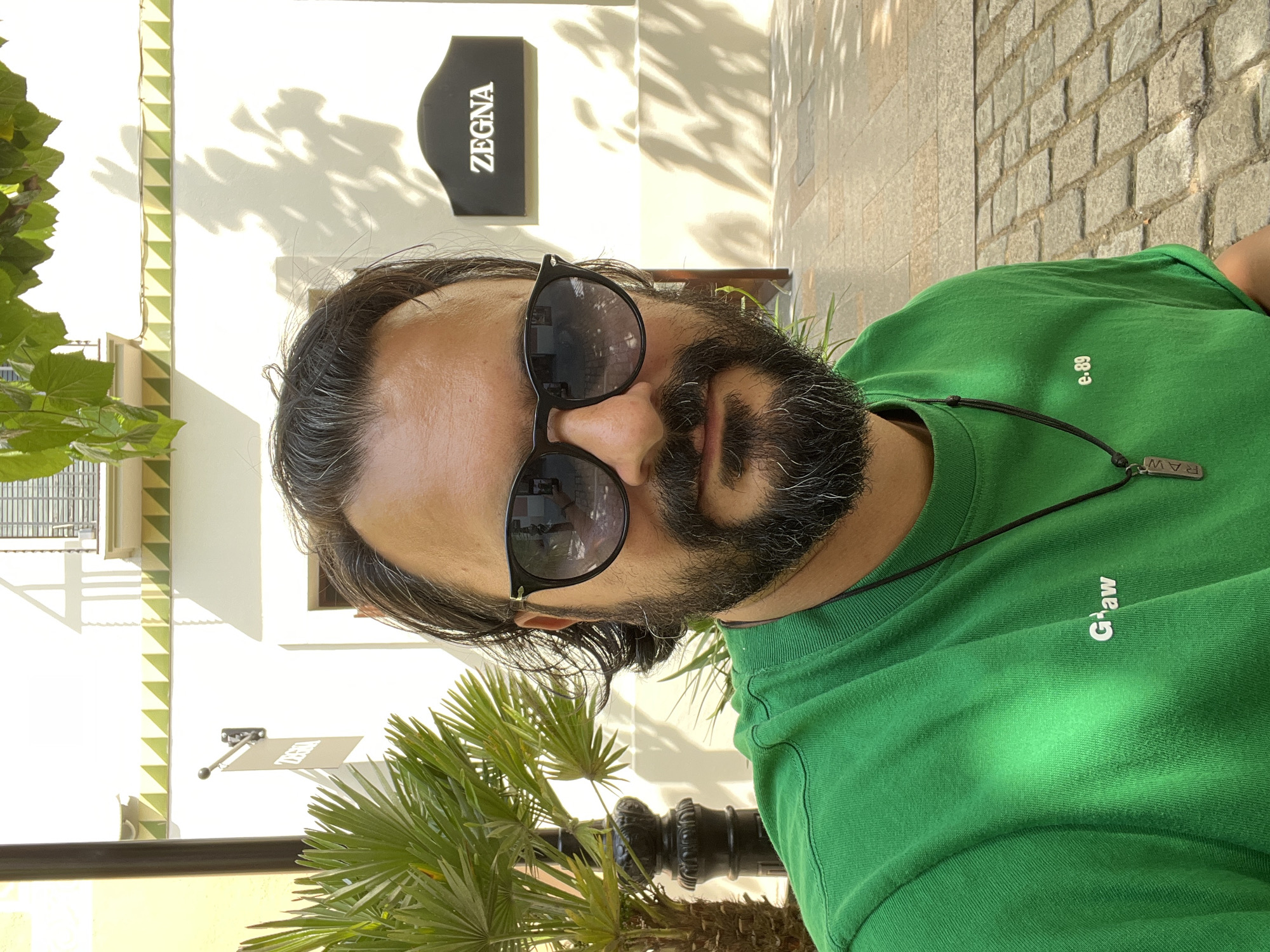 Man in green shirt spotted near Zegna store in Spain