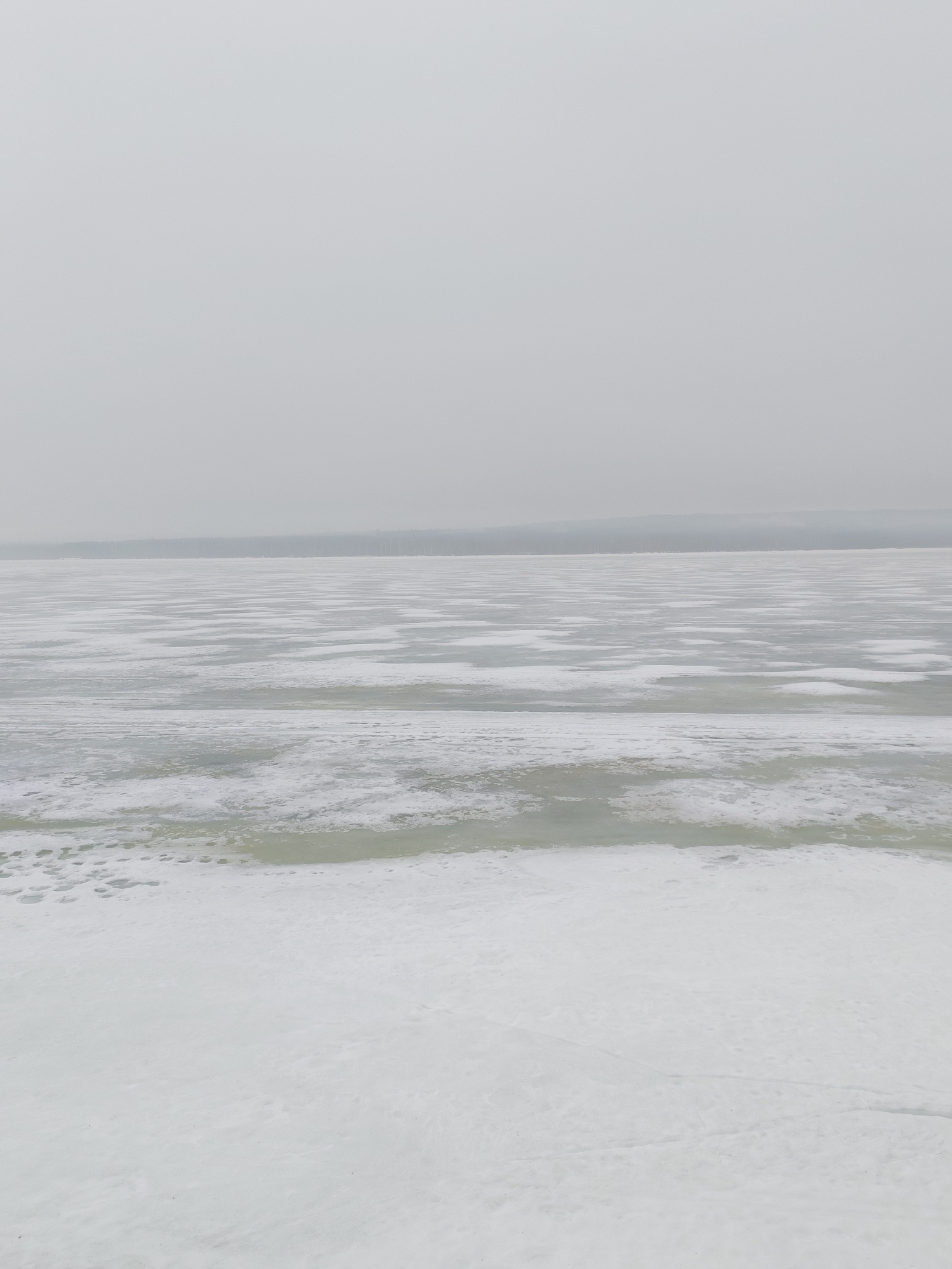 Spring scenes captured in Chaikovsky: frozen river, outdoor chess table