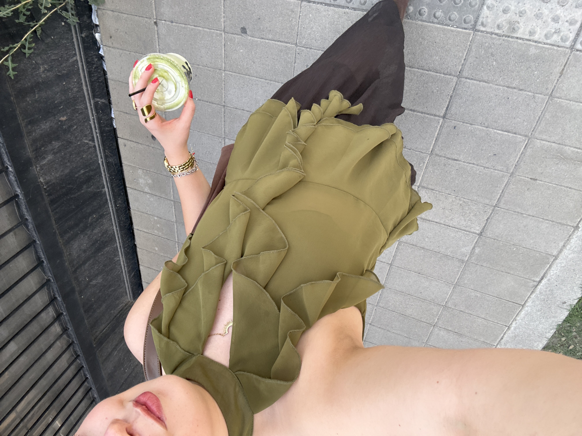 Person enjoys matcha and books during cultural space visit