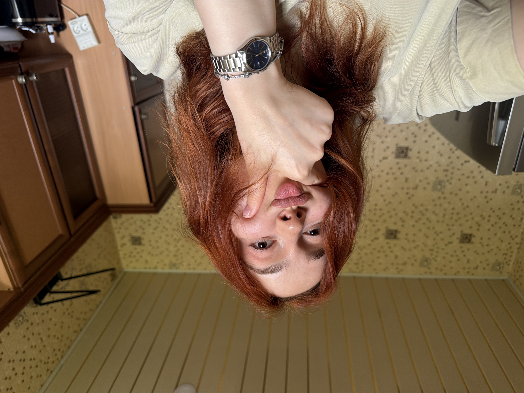 Woman takes selfies while eating candy in Tbilisi home