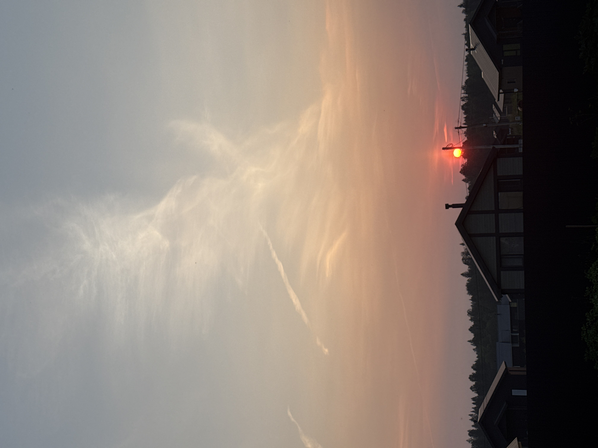 Soft summer sunset over a quiet Russian village