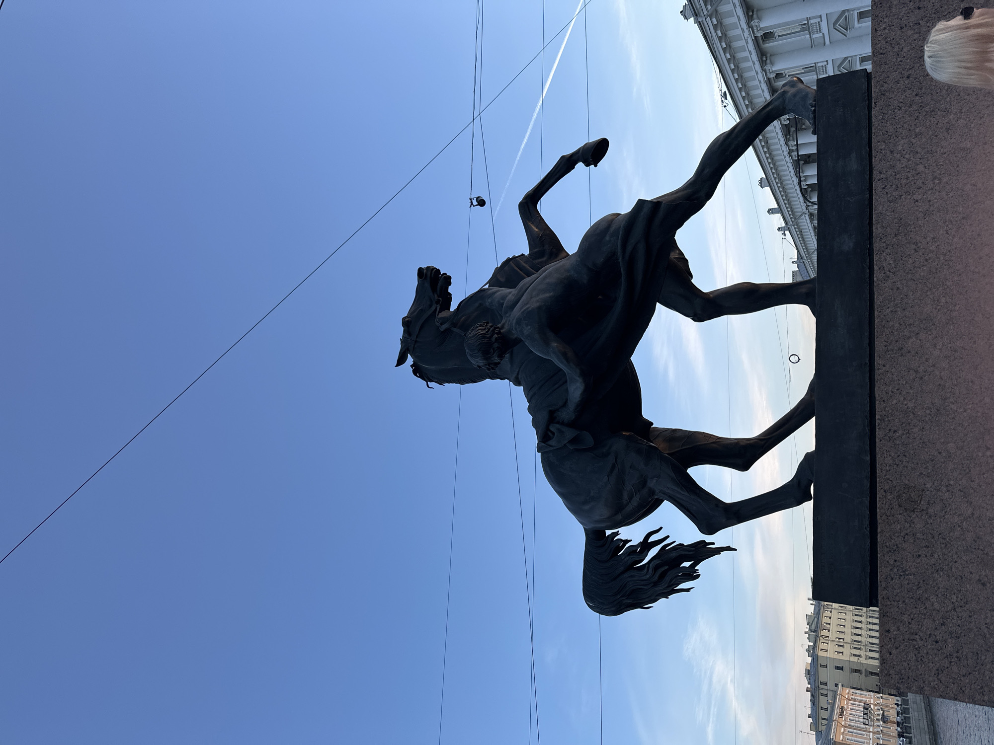Tourist documents Saint Petersburg landmarks and streetscapes during afternoon walkabout