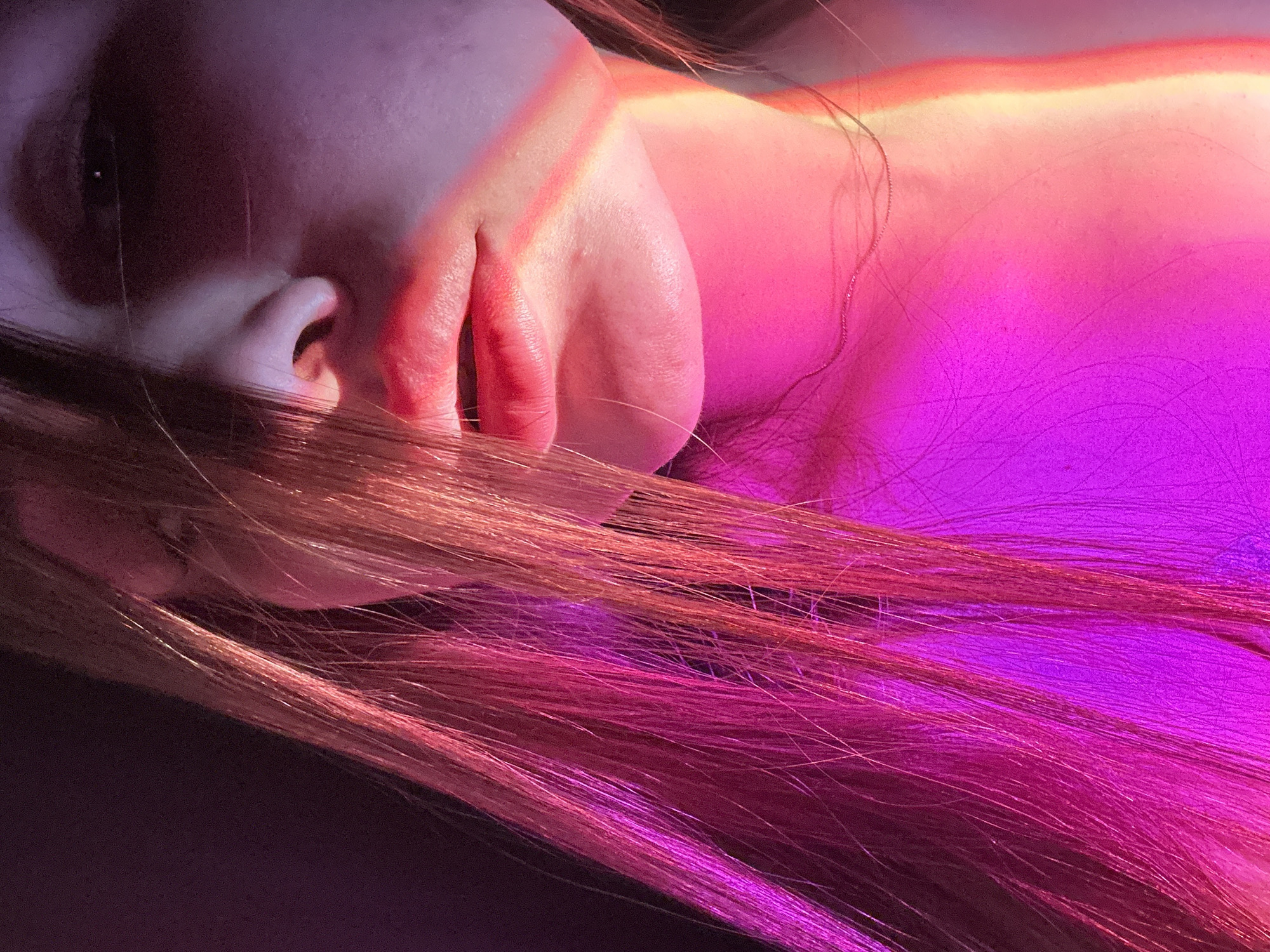 Intimate portrait session with colored lighting documented in Chaikovsky