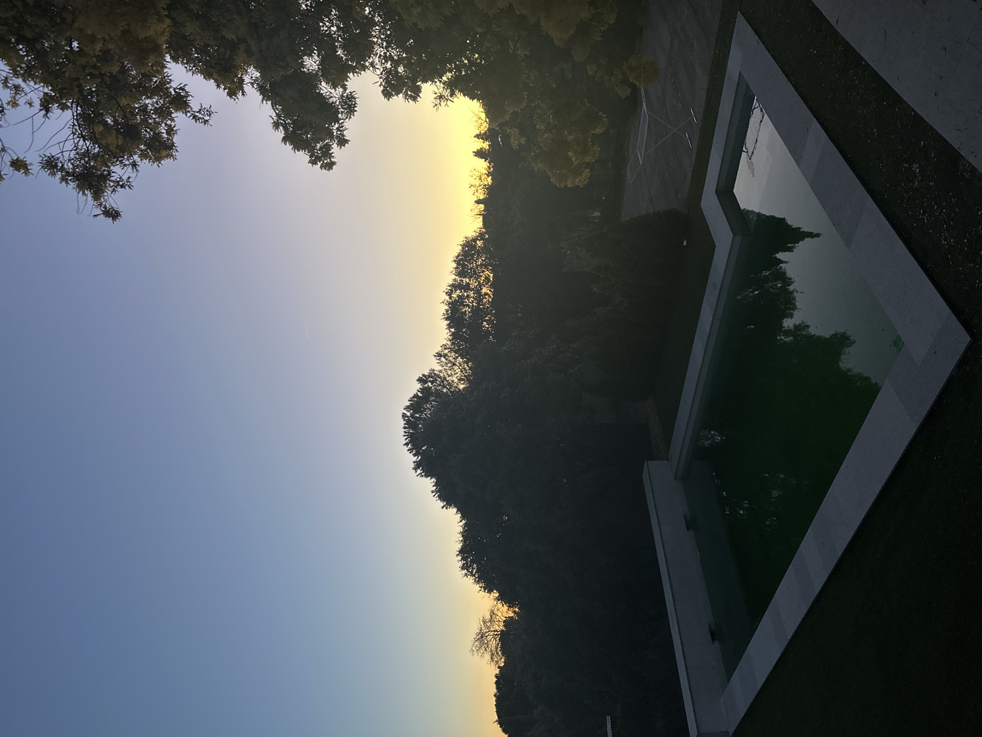 Evening pool reflections captured at dusk in Torrelodones garden