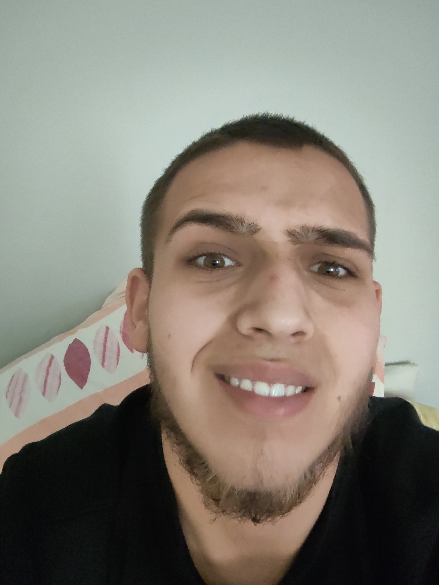 Young man takes smiling selfie in Sofia