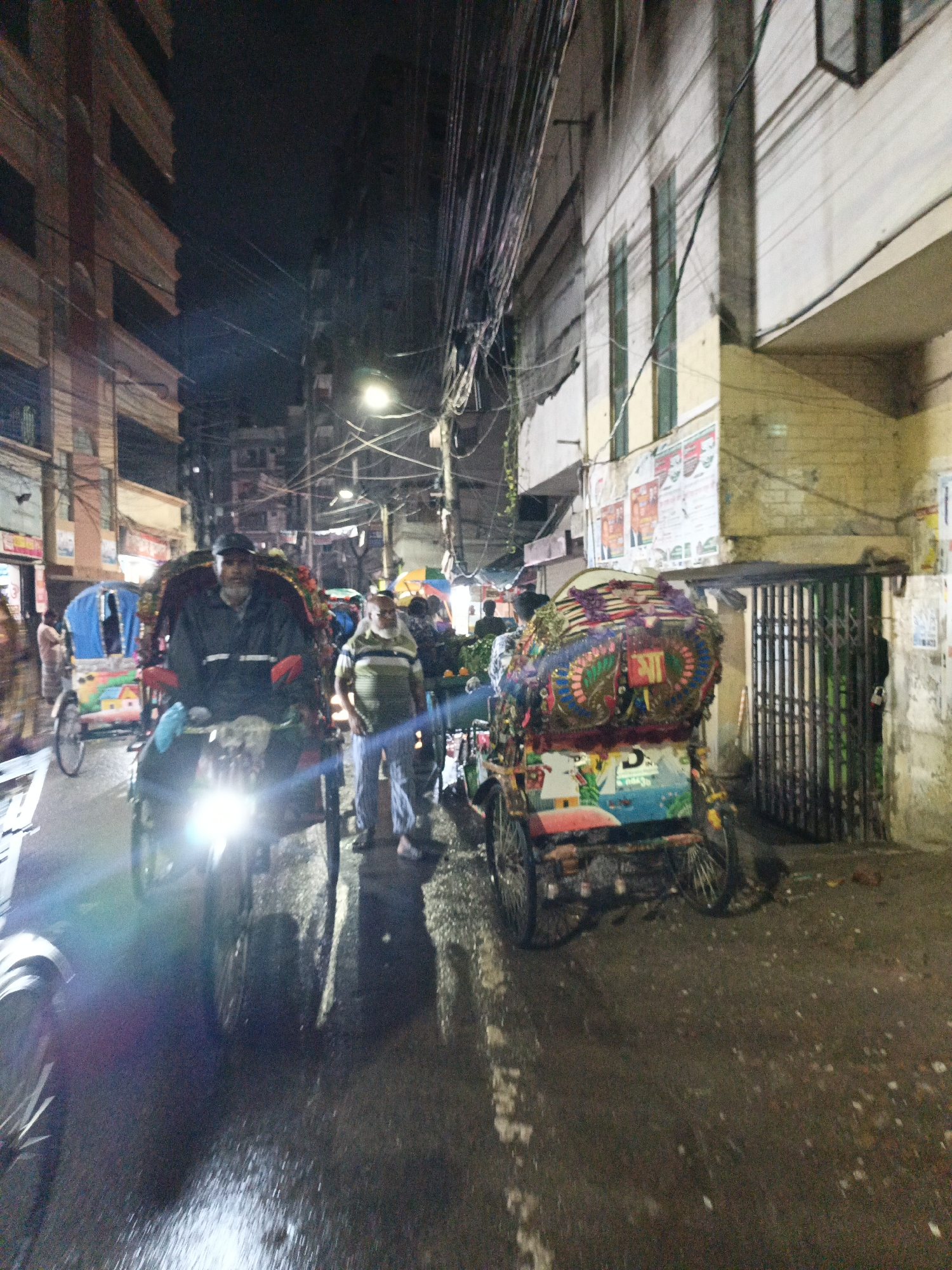 Evening street market activity documented across urban district