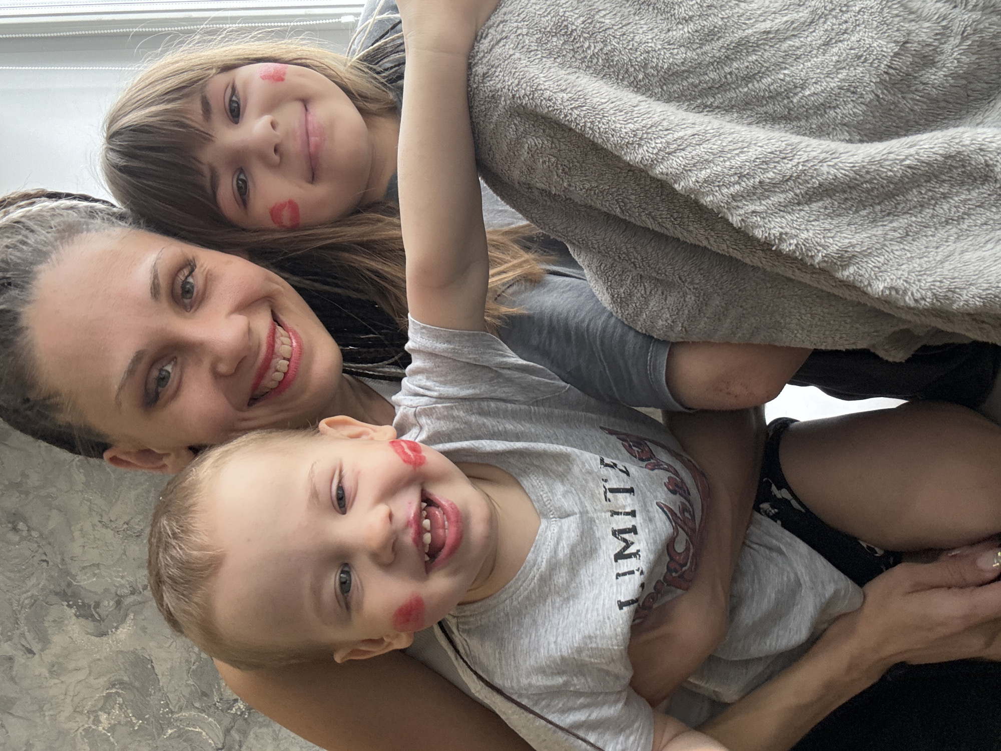 Family shares intimate moment indoors in Rusanovo, Russia